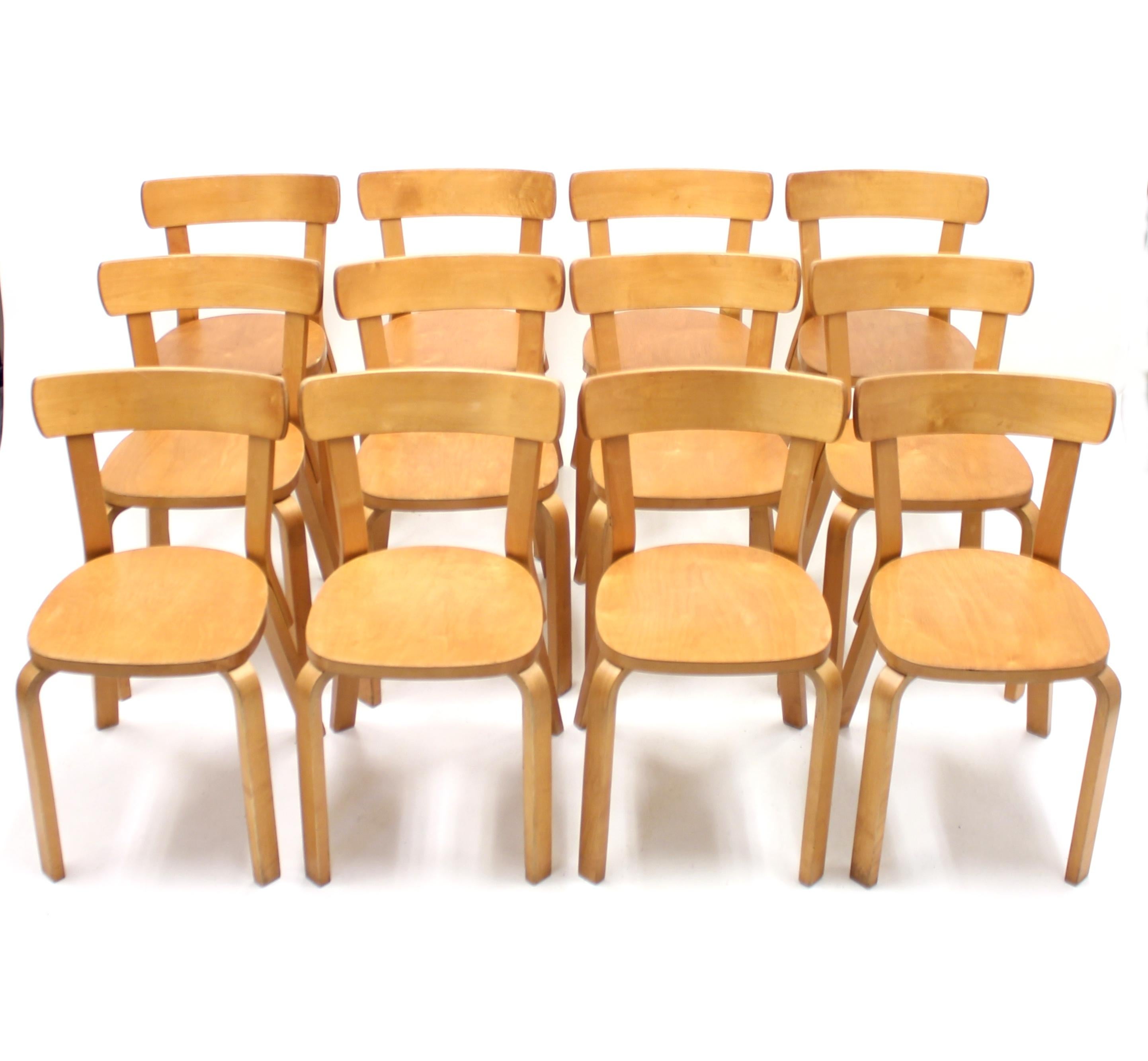 Set of 12 chairs, model 69, designed by Alvar Aalto for Artek in 1935. This set was produced by the Artek factory in Hedemora, Sweden circa 1950. Frame of steam bent birch. The Hedemora factory took over all production for Artek between 1946-1956