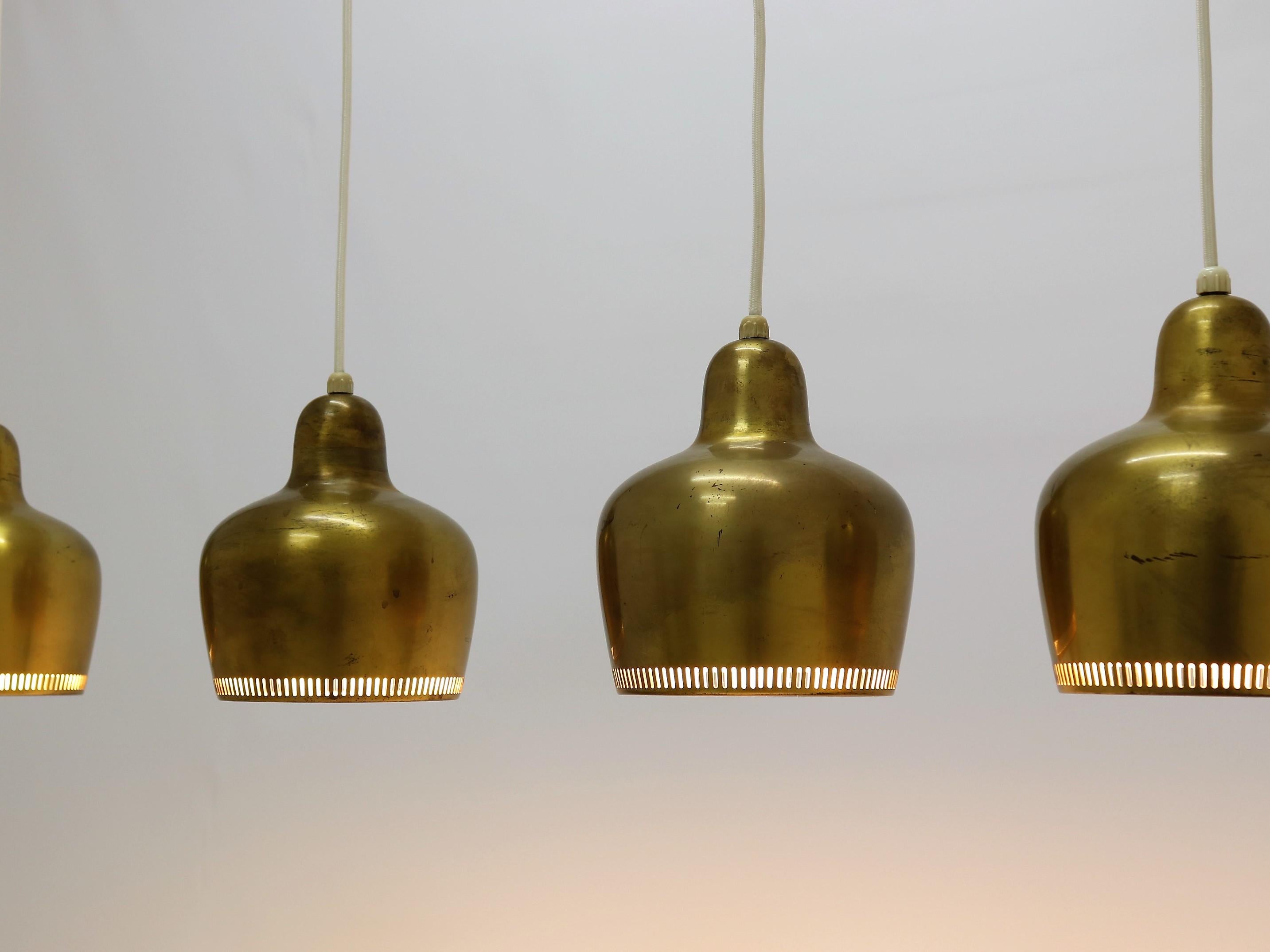 Rare set of original vintage brass pendants by Alvar Aalto for Louis Poulsen, Denmark. The pendants are made from solid brass and lacquered on the inside. Designed by Alvar Aalto for the Savoy restaurant (Helsinki) in the 1950s. Sometimes referred