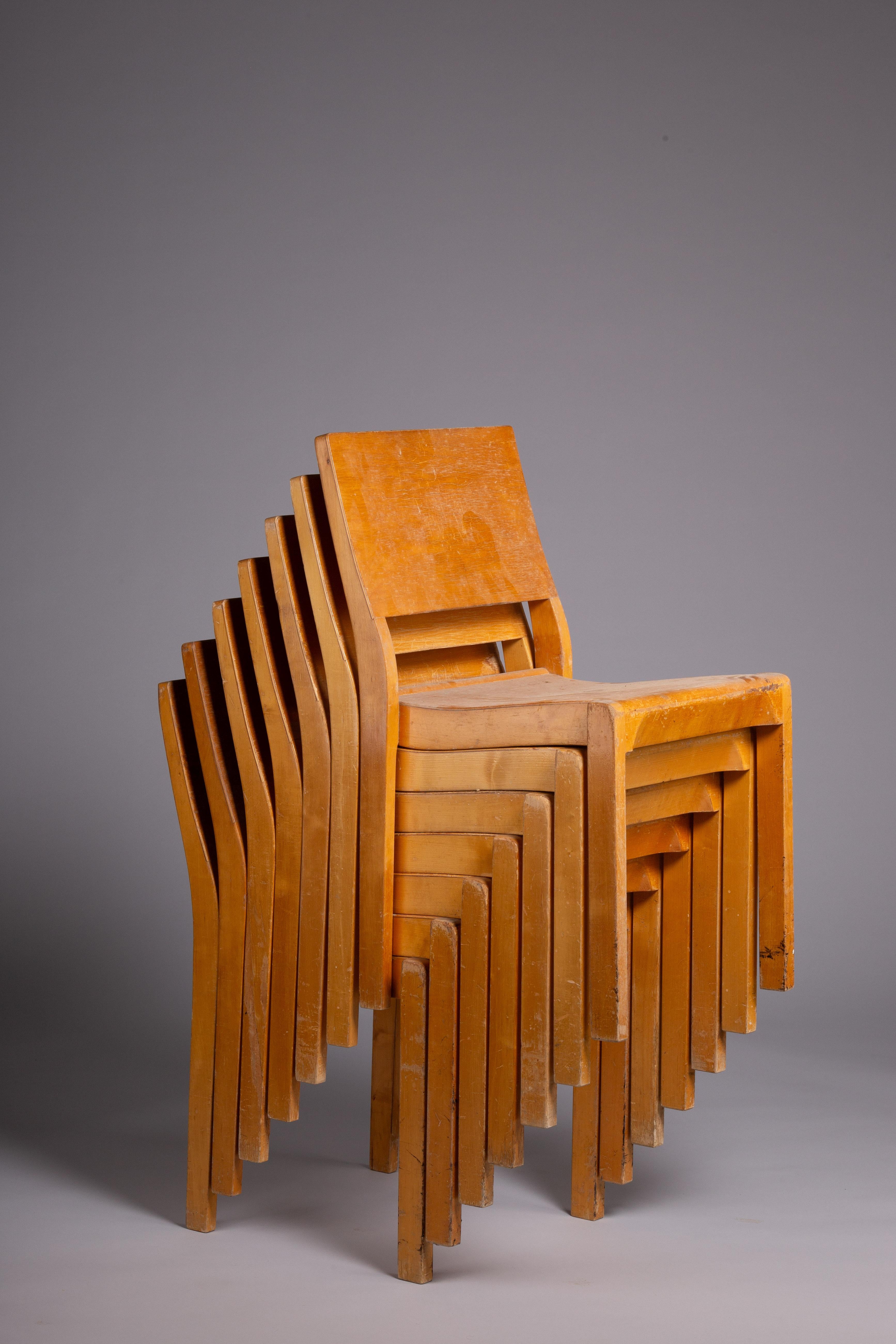 Elevate your space with this exquisite set of 6 c. 1940's model 611 chairs, masterfully designed by Alvar Aalto and Otto Korhonen in 1929. These chairs showcase a timeless Scandinavian aesthetic, enhanced by a beautiful honey patina that only grows