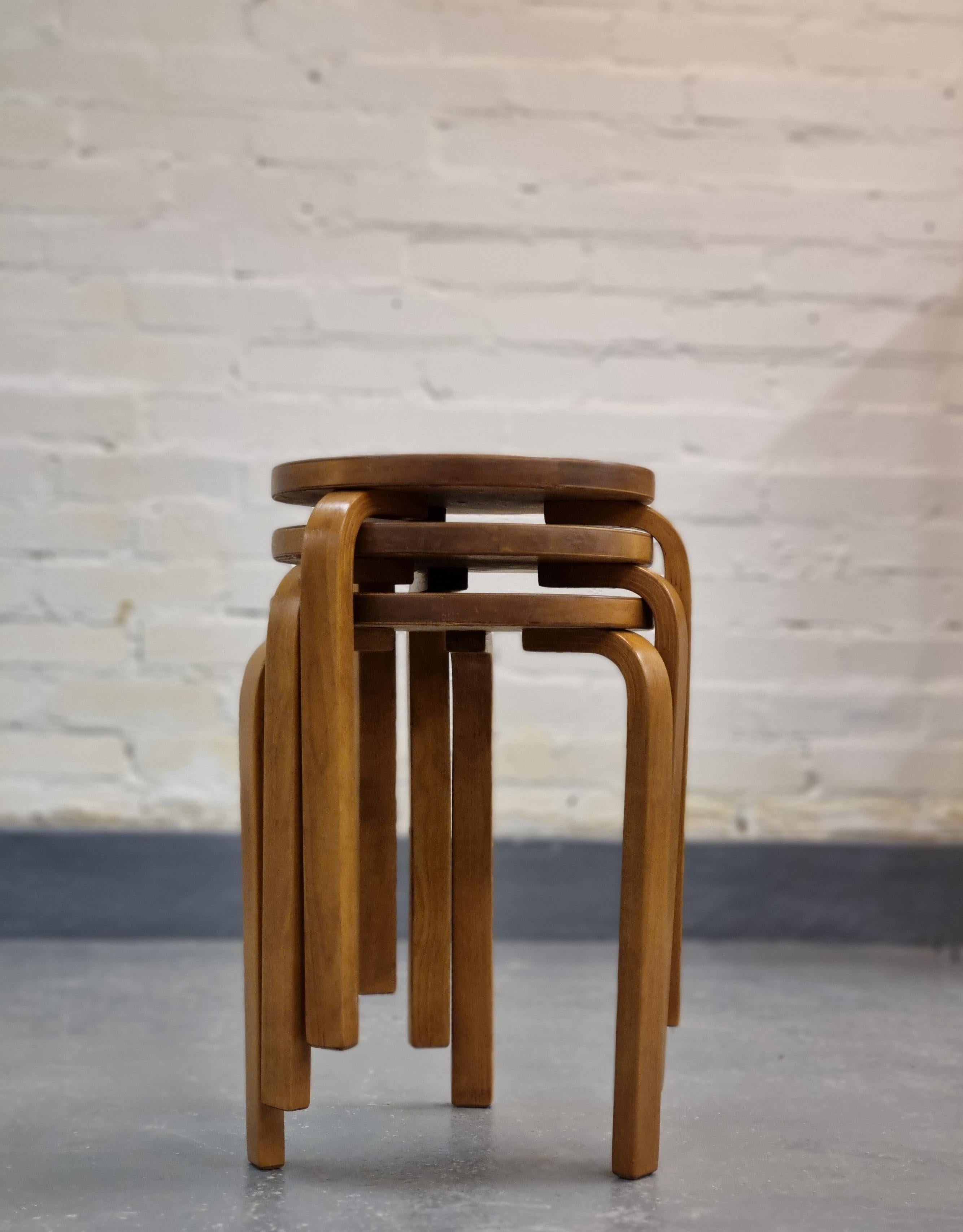 A beautiful set of three commisioned iconic 60 stool. These stools are higher than the standard model and stand at a height of.
The stools are in birch and have a beautiful patina. The surface is slightly refinished.
We offer free shipping on this