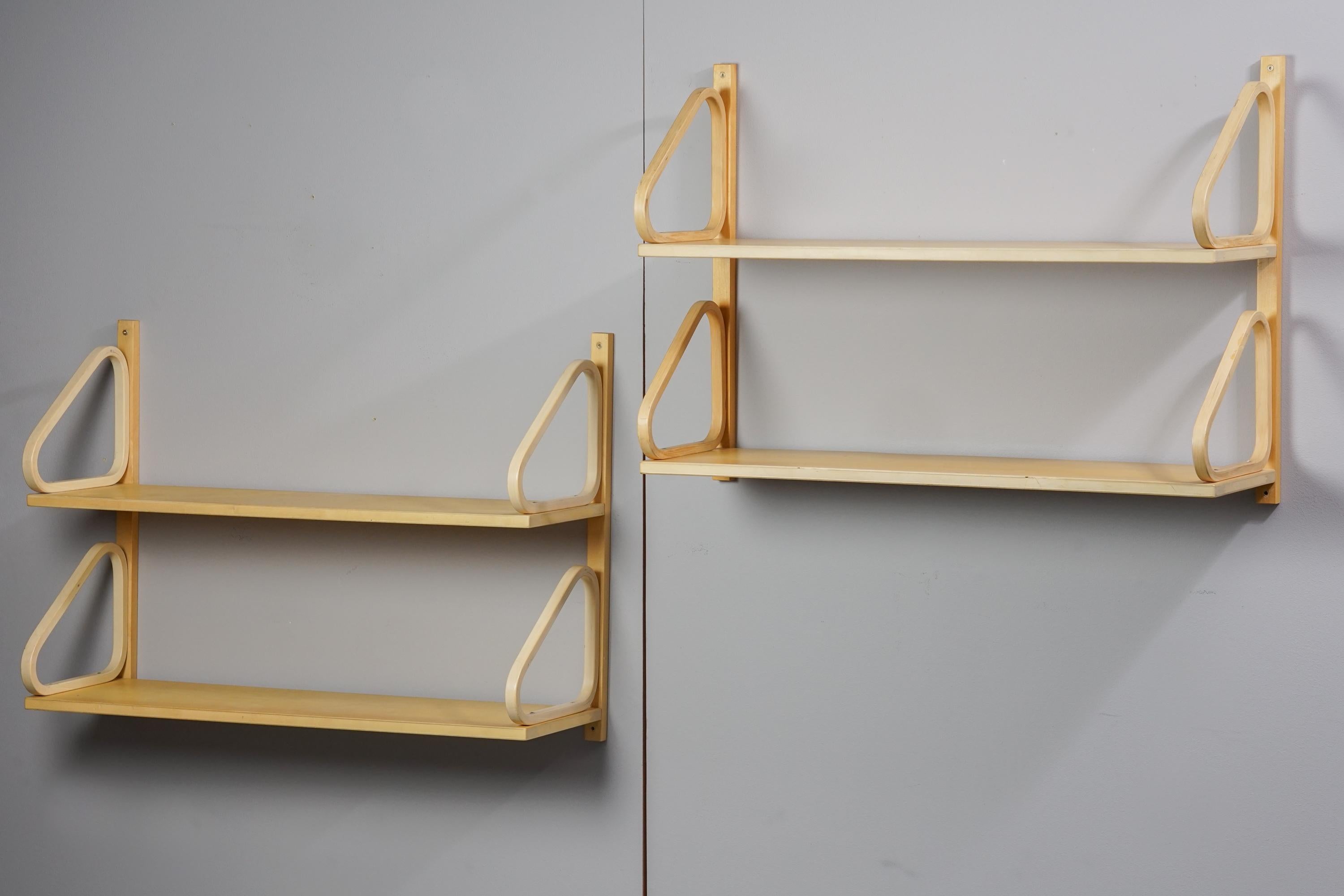 Alvar Aalto Shelve Model 112B-2 from the 1950s, manufactured by Artek. Birch. Good vintage condition, minor wear consistent with age and use. Iconic Alvar Aalto design. There are two shelves and they are sold separately.