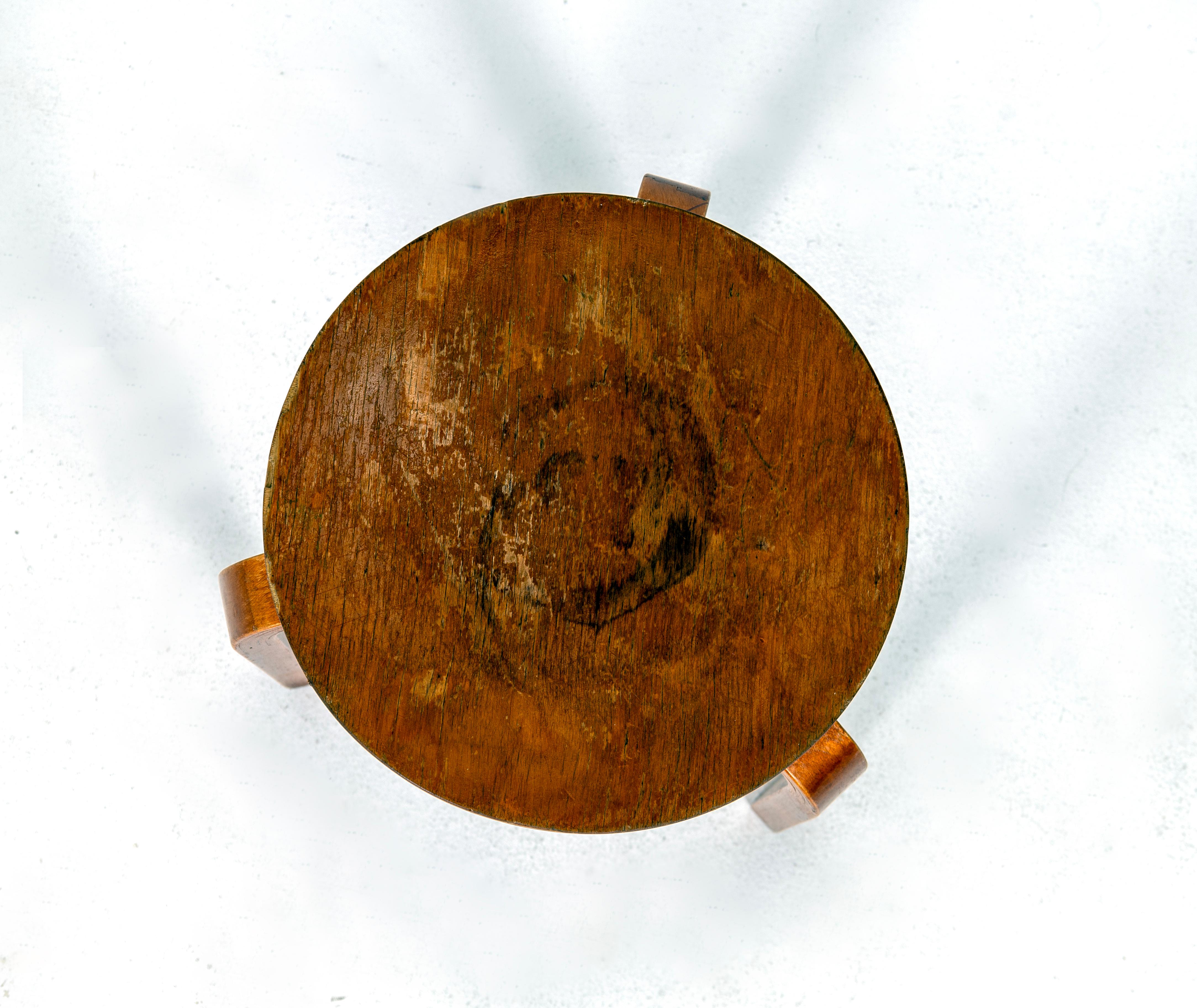 Stool 60 designed by Alvar Aalto, strong patina with some chips. Please see picture 3 for accurate color.