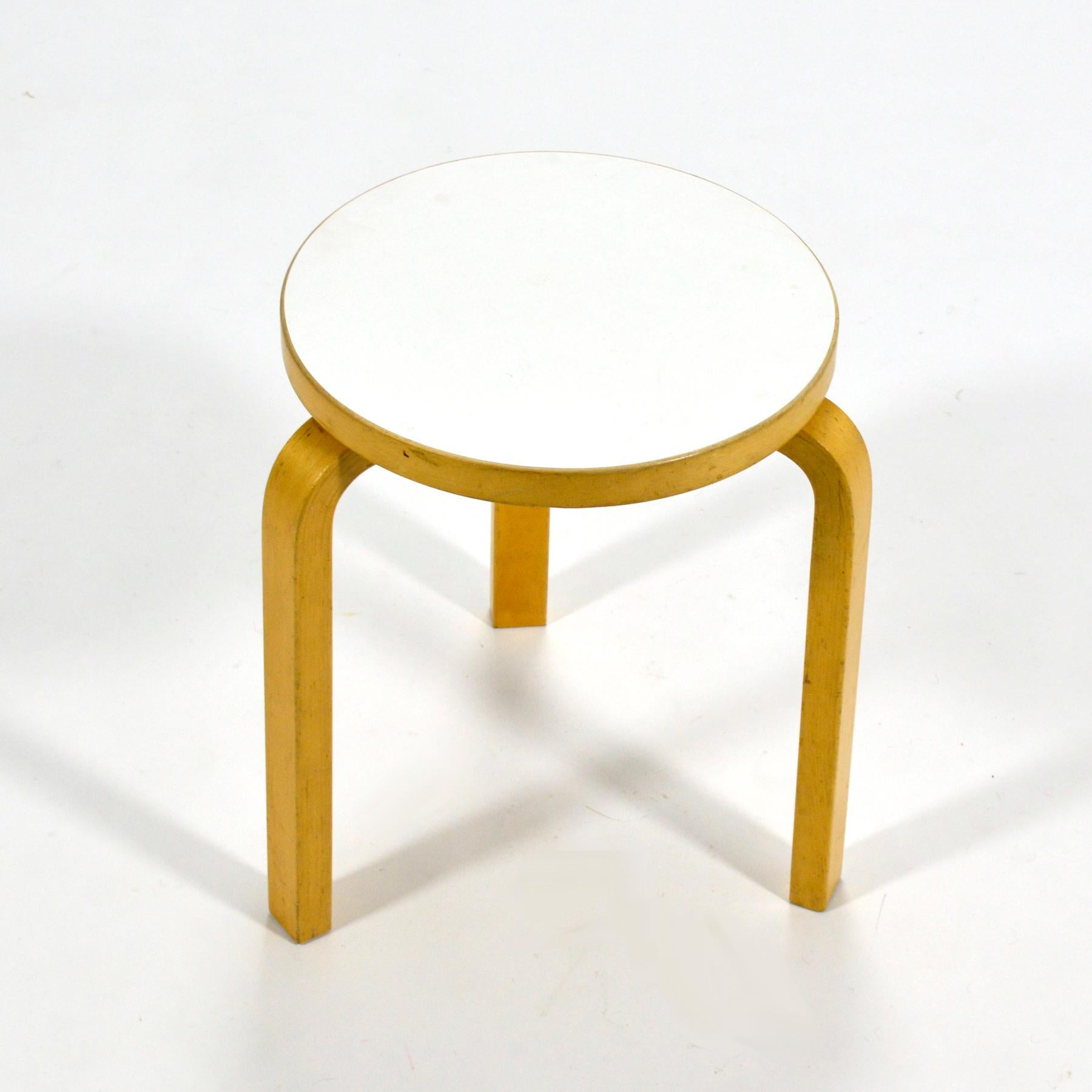 Aalto's stool 60 is the quintessential example of Aalto’s aesthetic. Designed in 1933, the bent, laminated birch legs with their sublime simplicity support a round top that can serve equally well as a seat or a table. This terrific vintage example