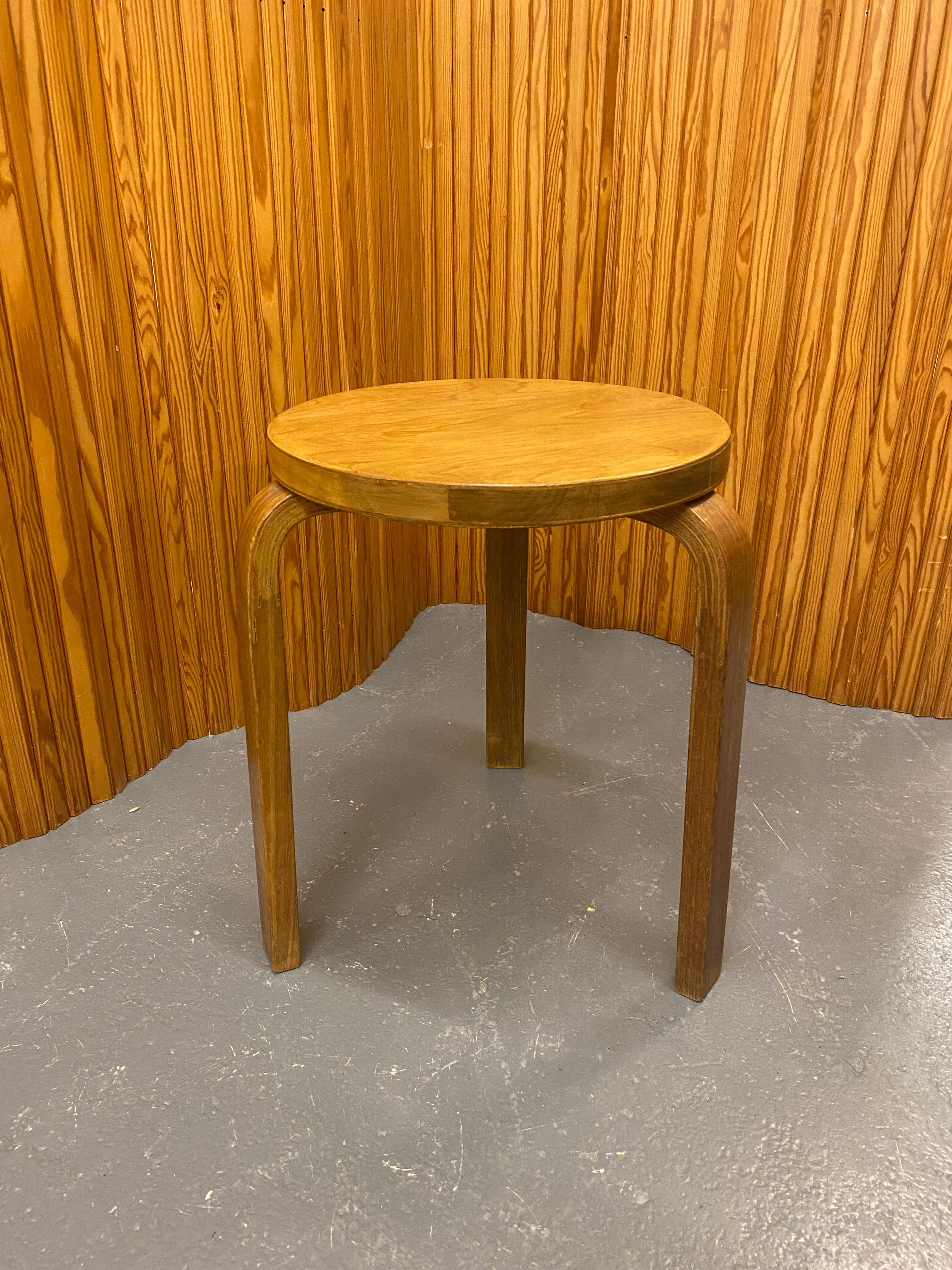 Artek stool in birch and beautiful dark patina, designed by Alvar Aalto and manufactured by Artek in the 1950s. The model 60 stool is perhaps the most well known Aalto design and has always been attractive to people. As with a lot of Alvar Aalto's