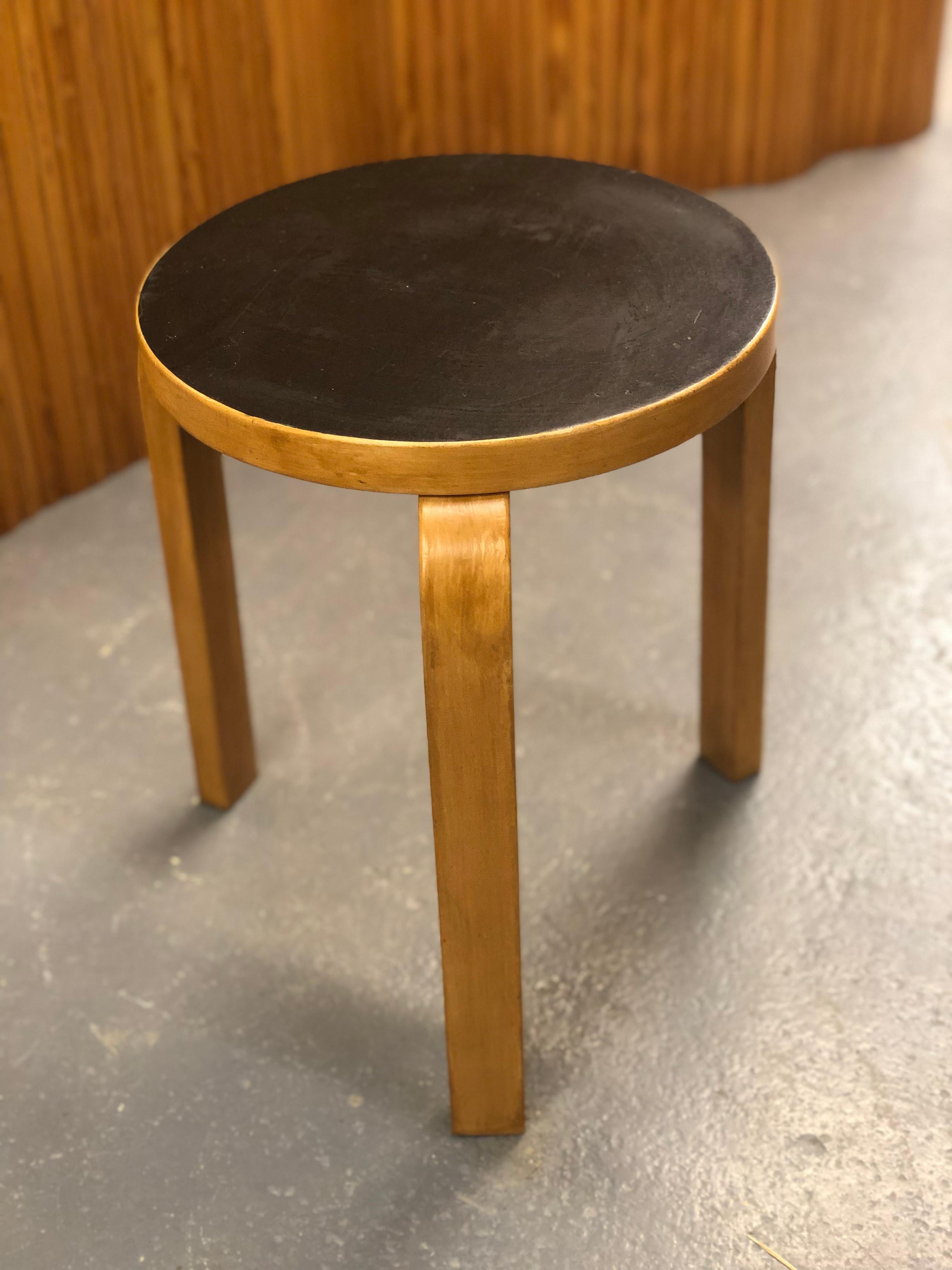 Artek stool in birch and black linoleum, designed by Alvar Aalto and manufactured by Artek in the 1950s. The model 60 stool is perhaps the most well known Aalto design and has always been attractive to people. As with a lot of Alvar Aalto's works 