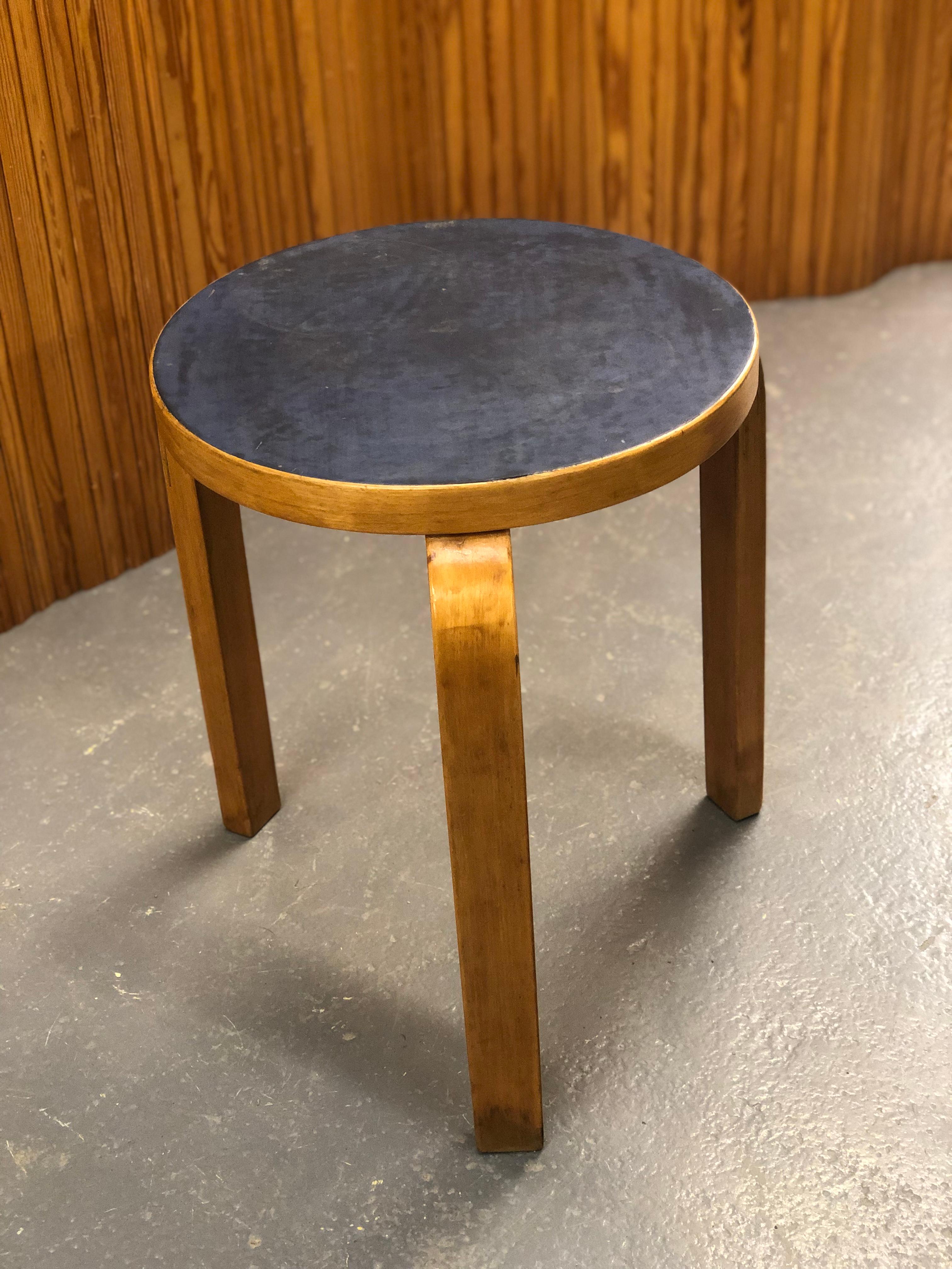Artek stool in birch and blue linoleum, designed by Alvar Aalto and manufactured by Artek in the 1950s. The model 60 stool is perhaps the most well known Aalto design and has always been attractive to people. As with a lot of Alvar Aalto's works the