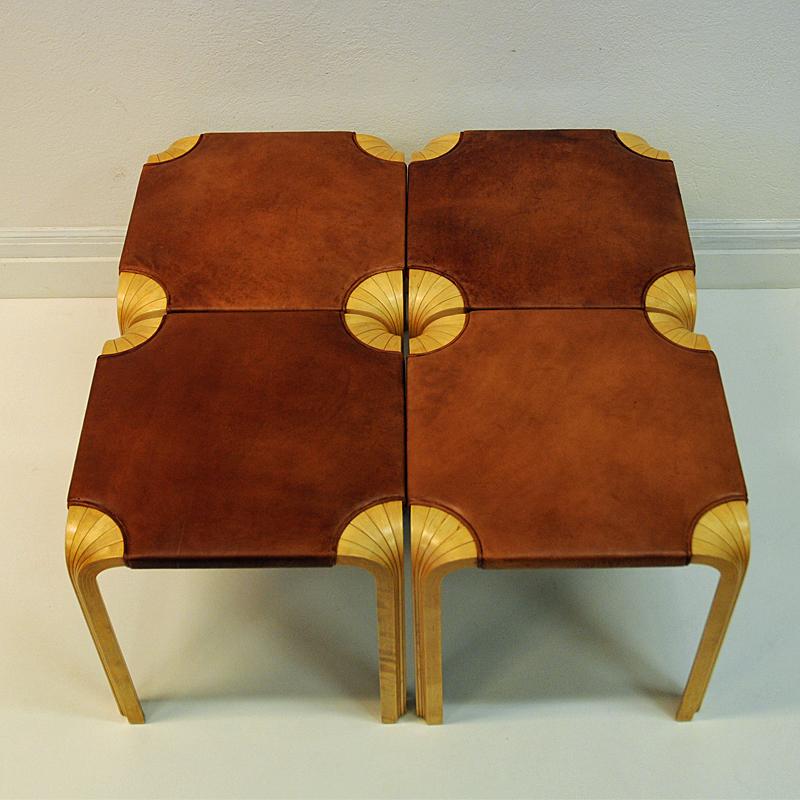 Finnish icons! Sold per piece. Beautiful work by well known Finnish designer Alvar Aalto - model X601 with cognac brown leatherseat and showcases the wonderful X-Leg or Fan leg innovation. Really nice as a group of four together or as a single