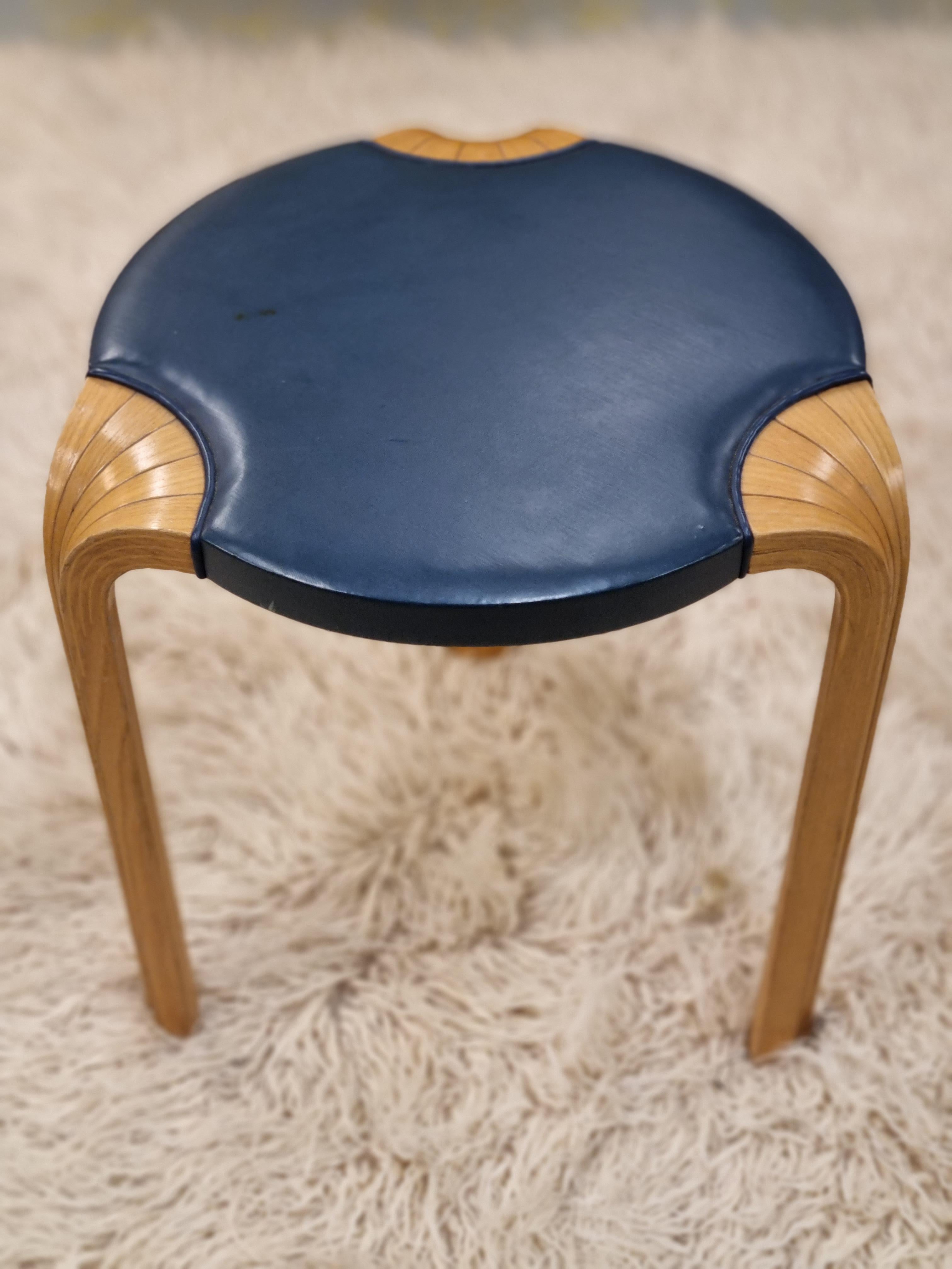Even though simple, this stool comes with great quality and attention to details. The less common X-leg with the leather padding bring plain beauty. The original blue leather makes this piece quite rare. This stool is in good condition with some
