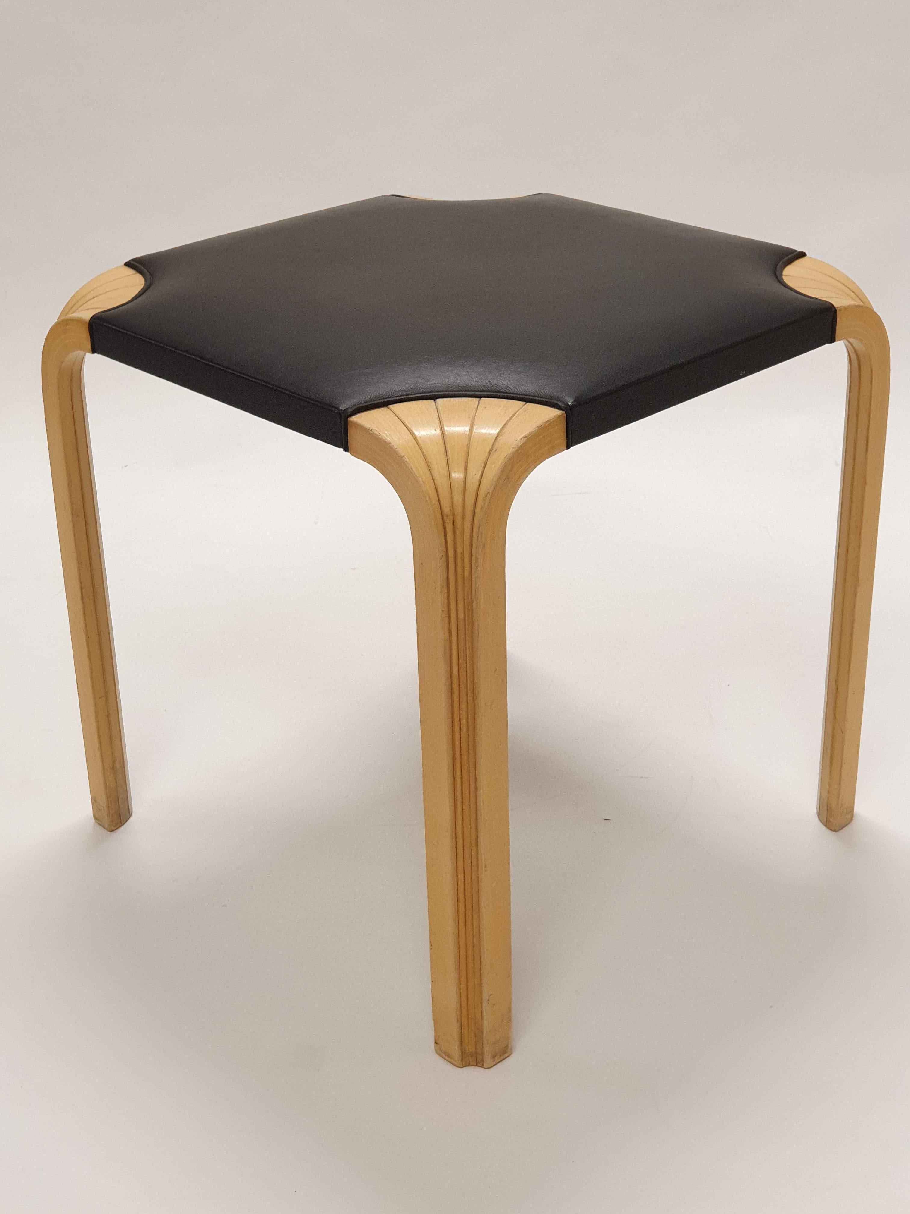 Artek X601 stool, design by Alvar Aalto. Birch with black leather, fan legs, wonderful patina of time. In good condition for its age. 

Artek X601 Stool, designed by Alvar Aalto in 1954, is a classic example of his minimalist, functional furniture