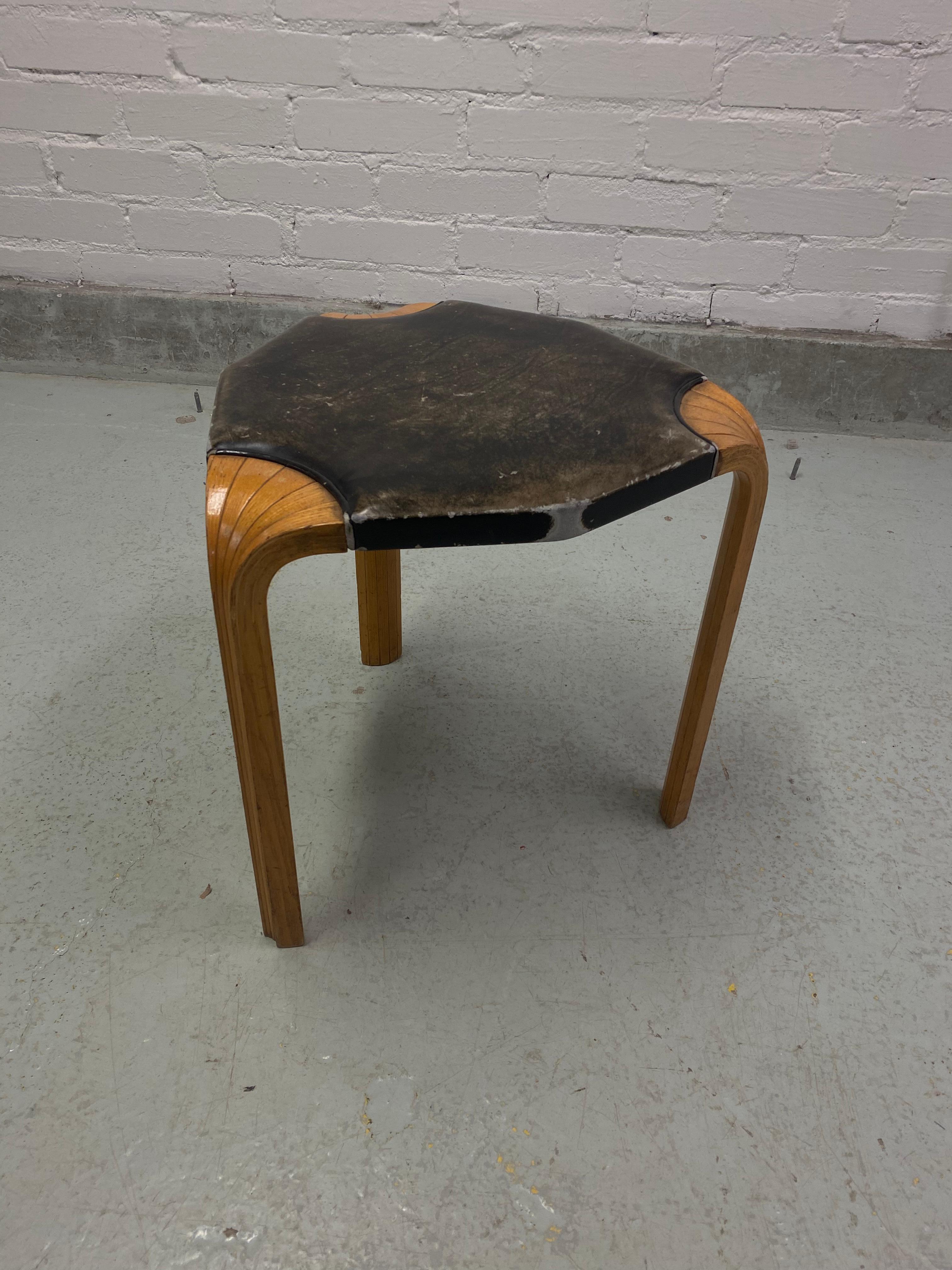Alvar Aalto stool model X602, manufactured in Finland by Oy Huonekalu-ja Rakennustyötehdas Ab back in the 1950s. 

A rare model, the X-leg stool is one of the simplest yet most brilliant designs by Alvar Aalto. Honey colored patinated bentwood legs