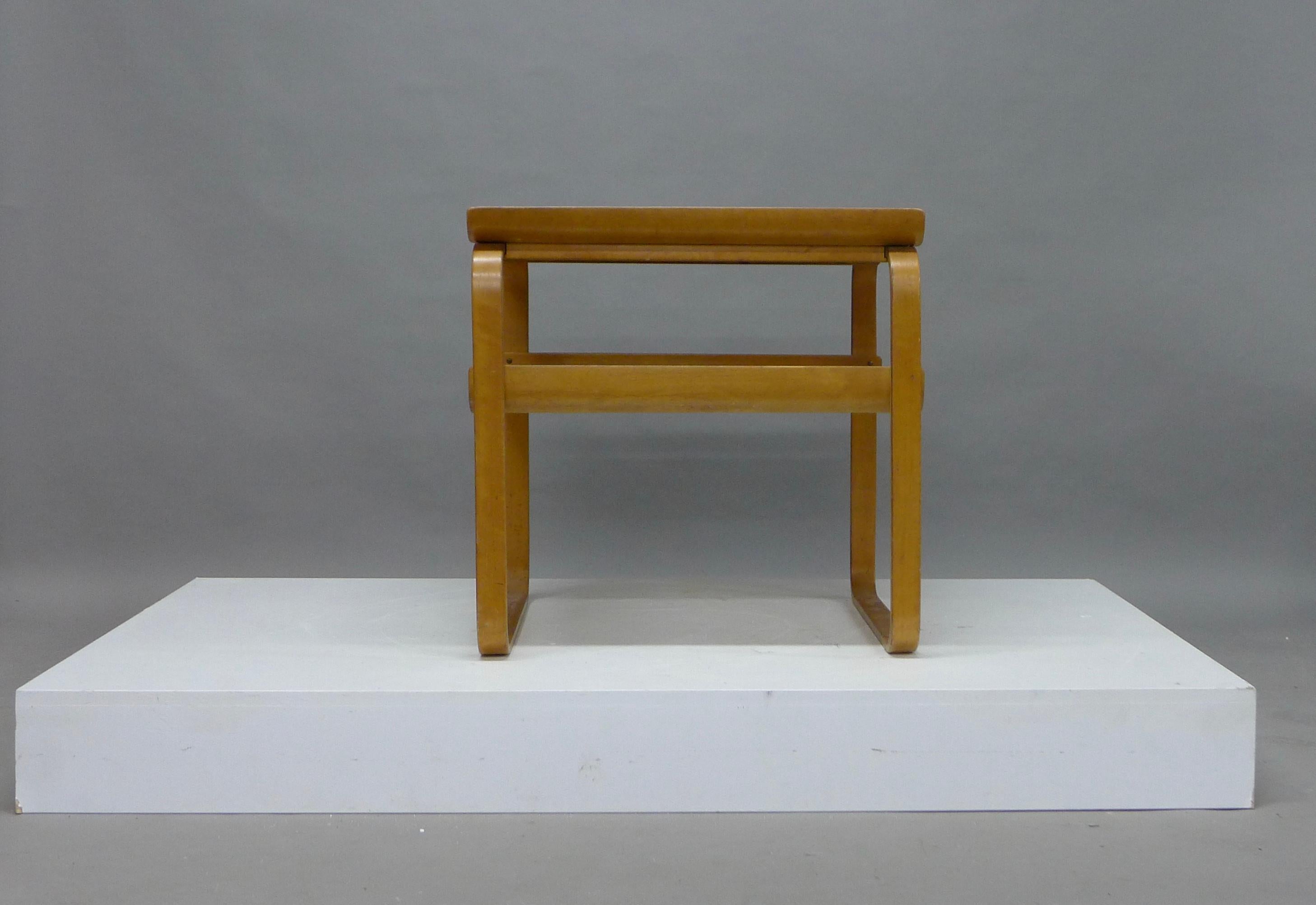 Alvar Aalto , two tiered table , model 915 first designed by Aalto in 1932 as part of the furnishings for the Paimio Sanitorium . Birch ply moulded legs supporting two birch ply shelves , looks to be completely original and likely from the 40's or
