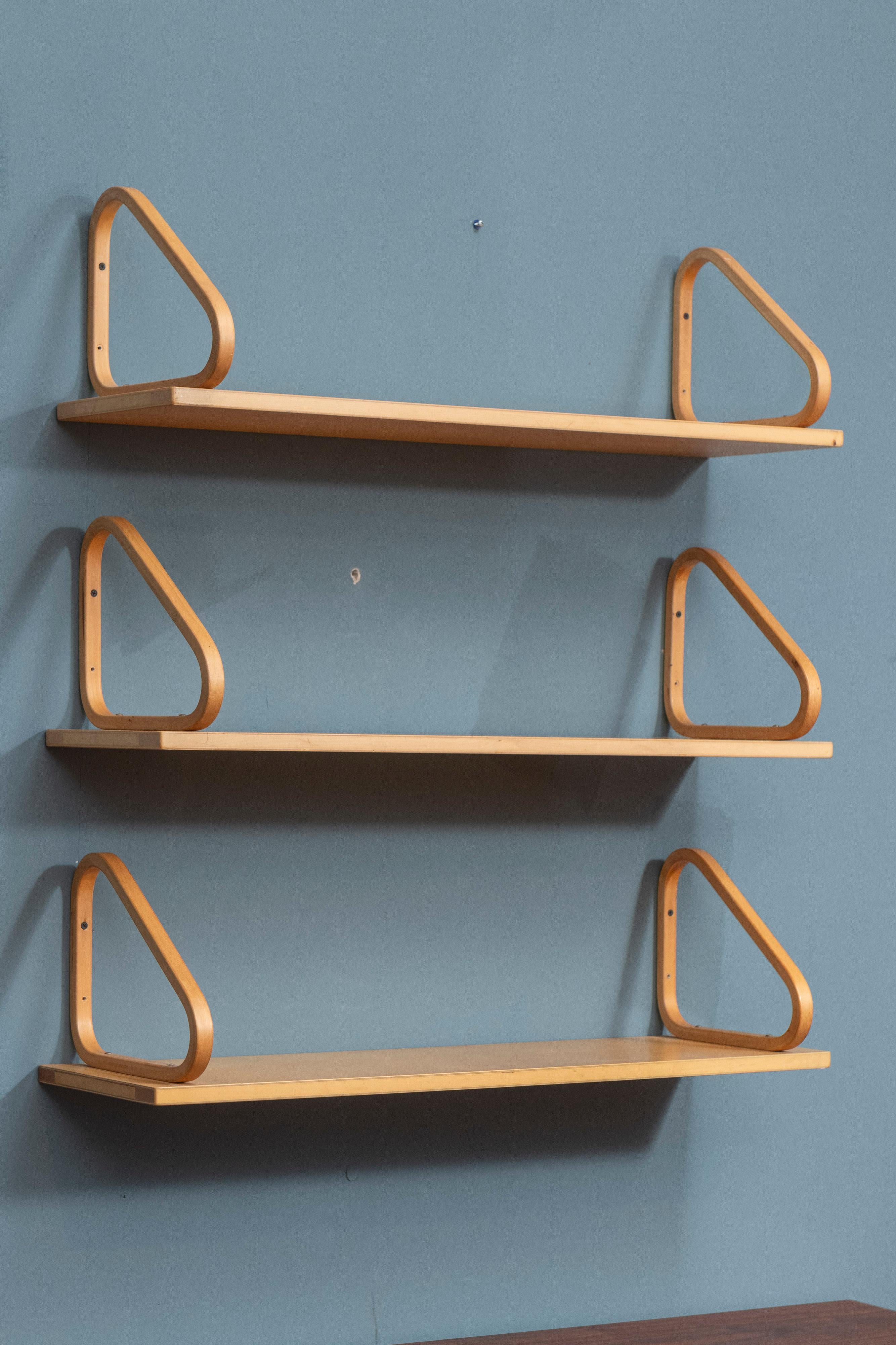 Alvar Aalto design wall shelves, model 112b. Super simple yet sophisticated shelves that are timeless classics by one of the masters of Scandinavian design. Warm patina with age appropriate wear but still present very well and ready to be installed