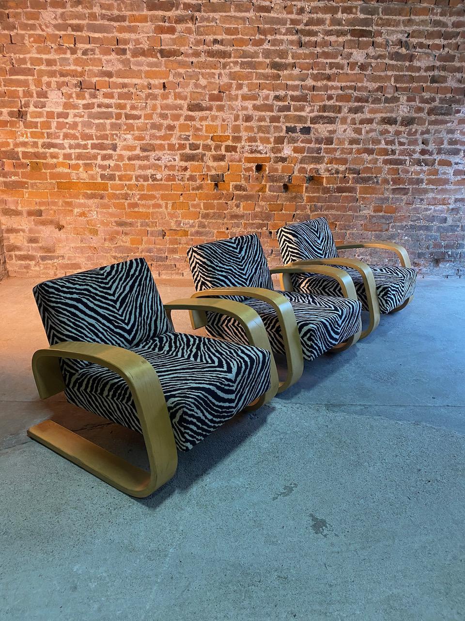 Alvar Aalto Zebra Tank chairs model 400 Pair by Artek, Finland, circa 1970

Magnificent pair of mid twentieth century 'Tank' Model 400 armchairs, designed by Alvar Aalto and manufactured by Artek, Finland Circa 1970, the laminated bent birch