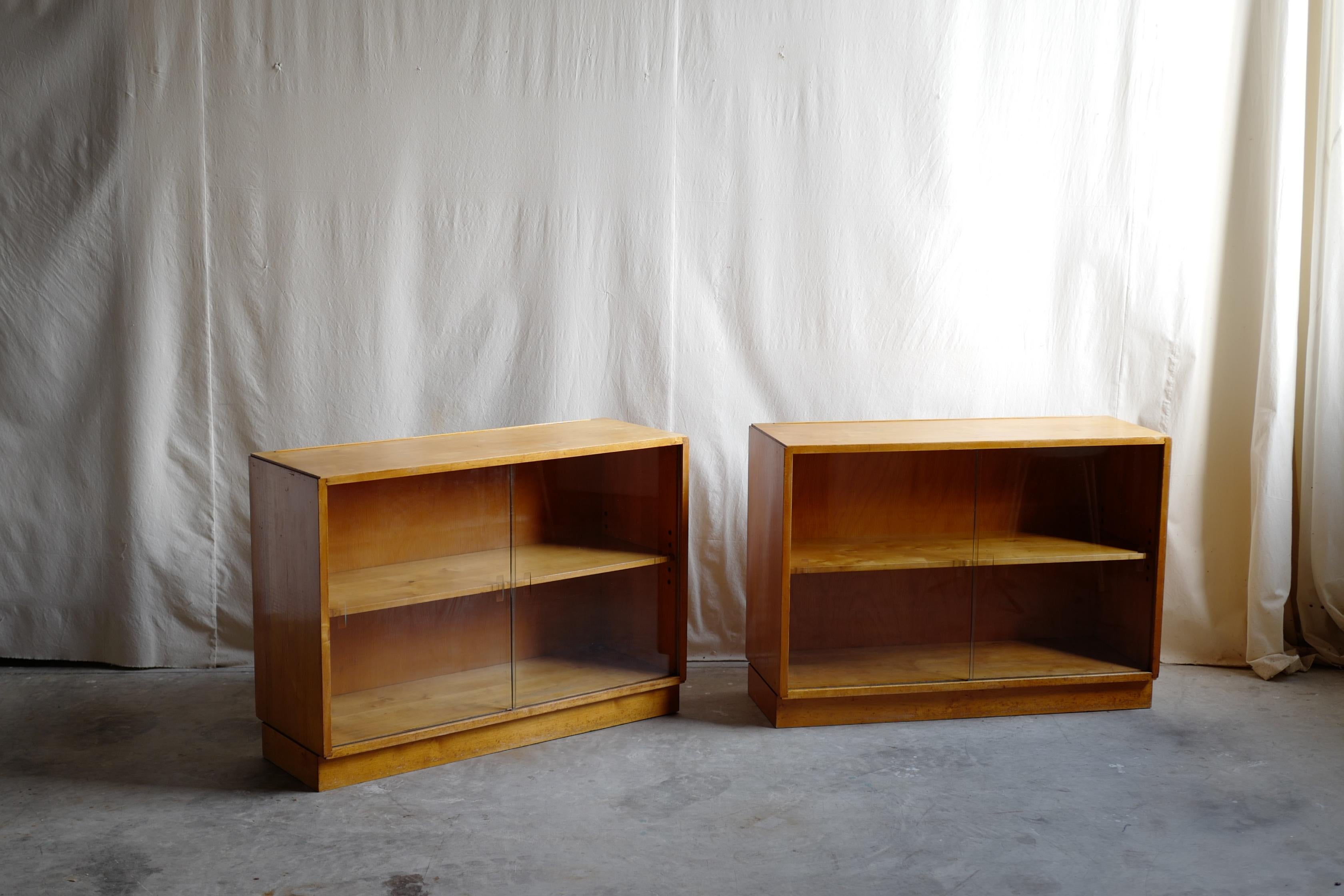 alvar & aino aalto design glass cabinet.
this is most earliest products of aalto furniture.
alvar & aino try to sell their furniture in UK as finmar.
So this is original condition. 
modernism make our world and it is normaly in our recently life,but