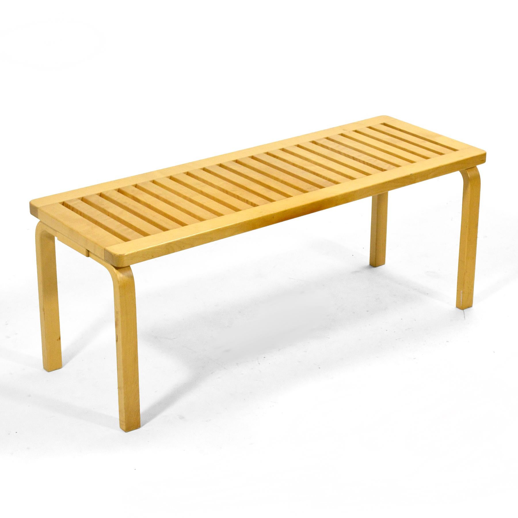 A classic Aalto design, this solid birch slat bench was produced made in Finland by Artek and sold in the U.S. by ICF.