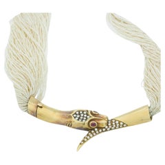 Collana Alvaro Correnti in oro 18 ct. con perle, rubini, diamanti e serpenti