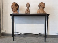 Bust portrait of a man with his mouth open, hand-carved in sycamore wood