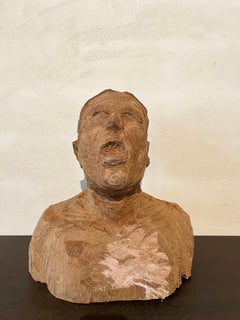 Bust portrait of a man with his mouth open, hand-carved in sycamore wood