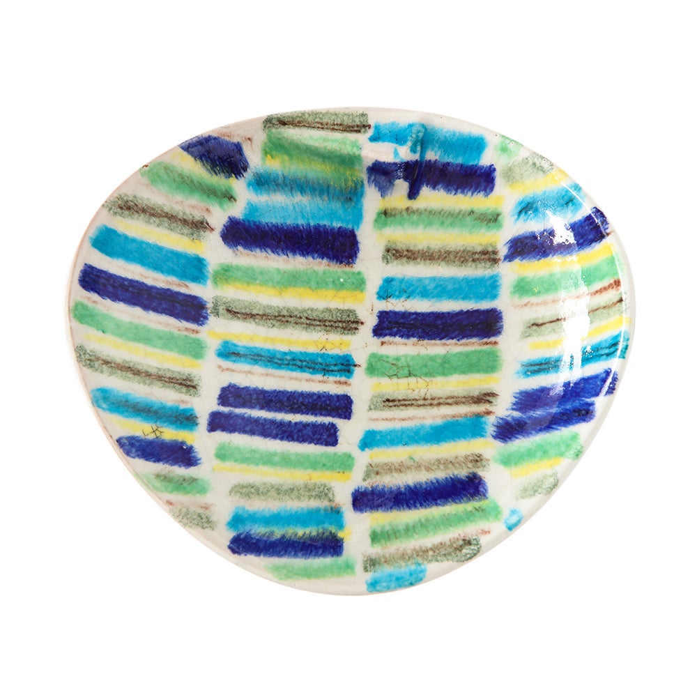 Alvino Bagni Ashtray, Ceramic, Stripes Blue, Yellow, White, Signed. Small scale scooped form ashtray or bowl with hand drawn dashed lines, glazed in light and dark blue, yellow, green and black over white glazed terracotta. Signed in black glaze on