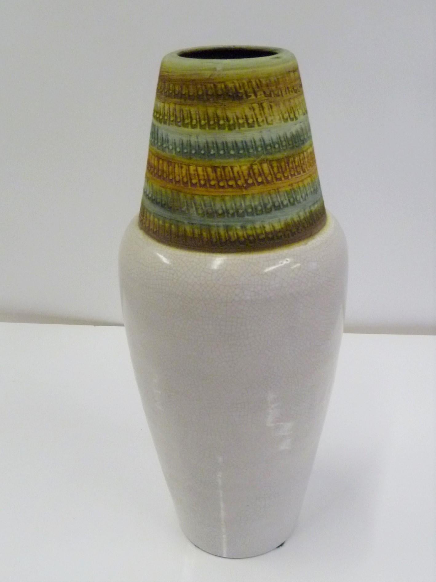 REDUCED FROM $450....A 1960s import from Italy, this tall Bitossi vase was designed by Alvino Bagni and has a shouldered form with a fine craquelure creamy glaze on the bottom topped with a textural impressed conical head and mouth in matte glaze in