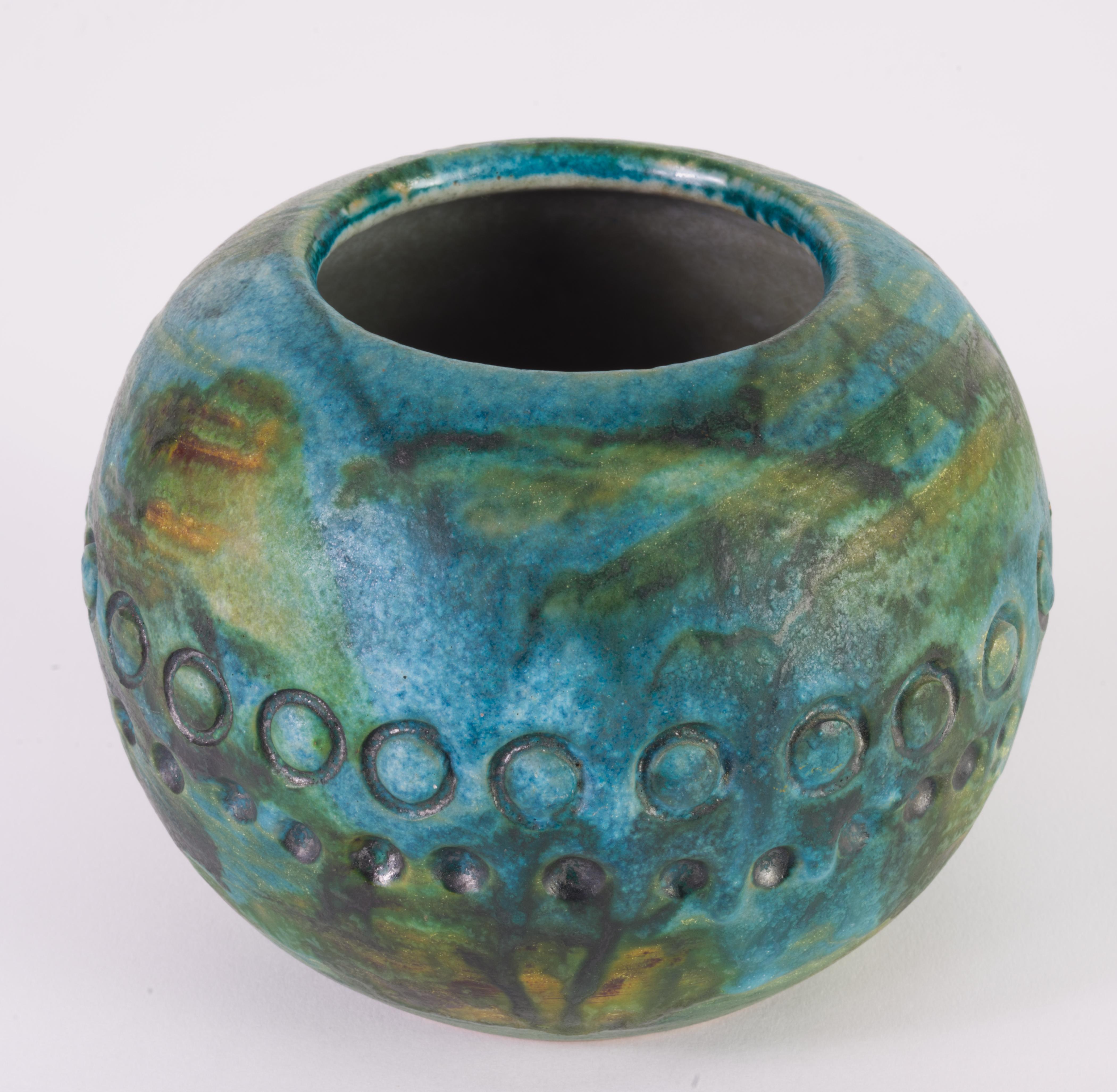  Vase or vessel was made by Alvino Bagni for Raymor as a part of his Sea Garden series. Sea Garden series includes vases, ashtrays, lamps, and other decor items done in complex turquoise glaze with shades of blue, green, yellow, and brown and