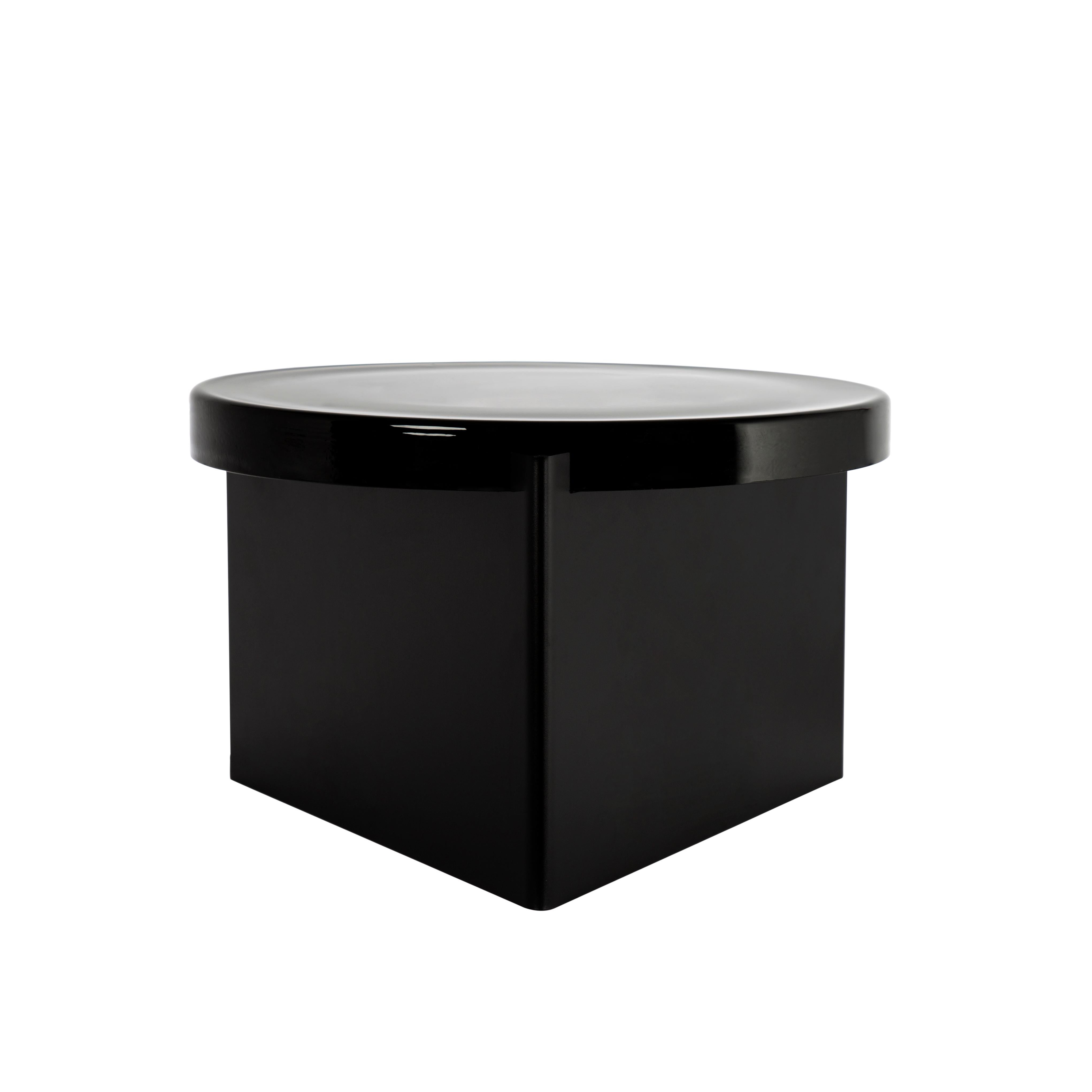 Alwa one big black coffee table by Pulpo
Dimensions: D56 x H35 cm
Materials: casted glass; powder coated steel 

Also available in different finishes. 

Normally, glass is regarded as being lightweight with sharp edges. In contrast, Sebastian