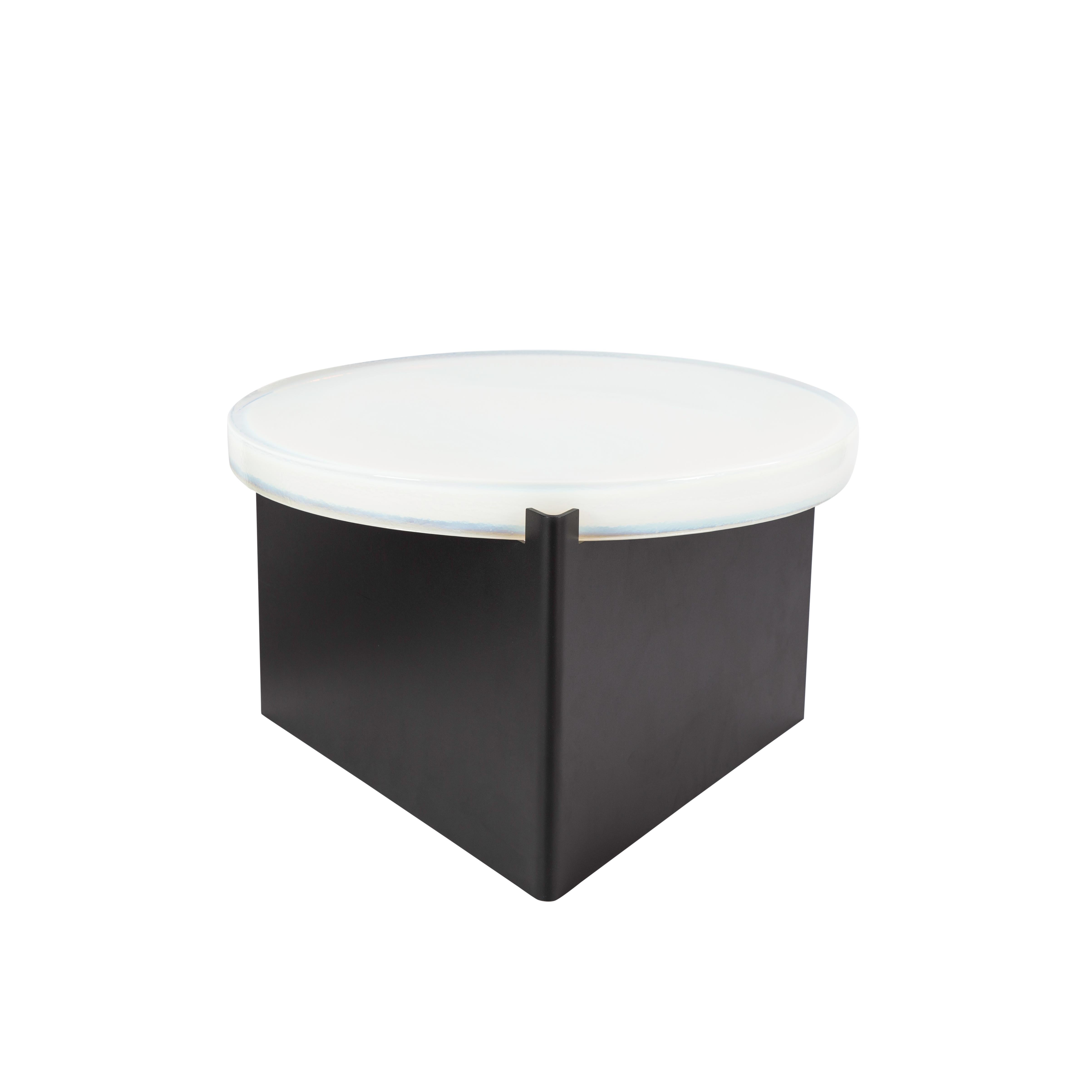 Alwa one big white black coffee table by Pulpo
Dimensions: D56 x H35 cm
Materials: casted glass; powder coated steel 

Also available in different finishes. 

Normally, glass is regarded as being lightweight with sharp edges. In contrast,