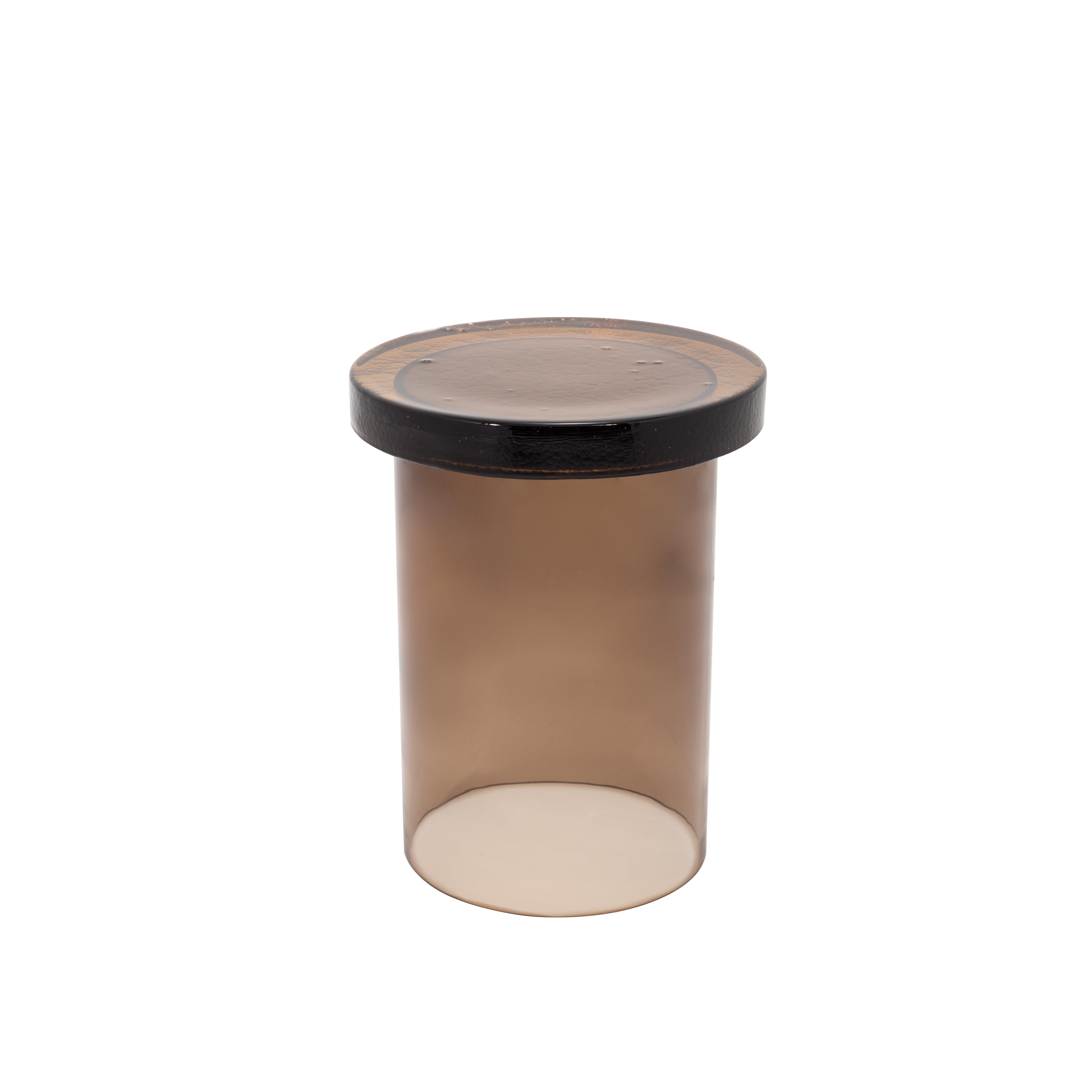Alwa three smoky grey side table by Pulpo.
Dimensions: D 38 x H 44 cm.
Materials: casted and hand-blown glass.
>>Also available in different colors. 

Normally, glass is regarded as being lightweight with sharp edges. In contrast, Sebastian