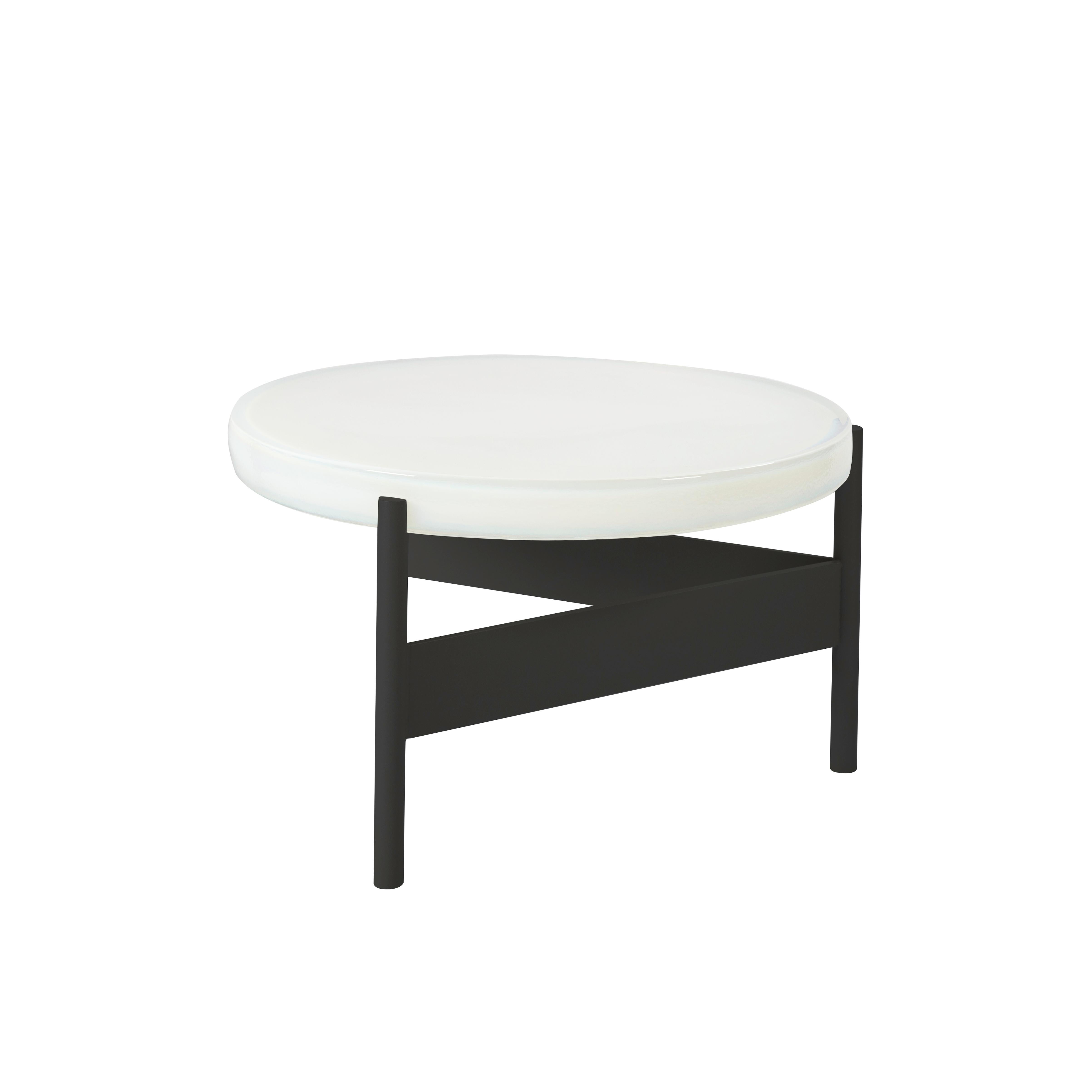 Alwa two big white black coffee table by Pulpo.
Dimensions: D56 x H35 cm.
Materials: casted glass; powder coated steel.

Also available in different finishes.

Normally, glass is regarded as being lightweight with sharp edges. In contrast,