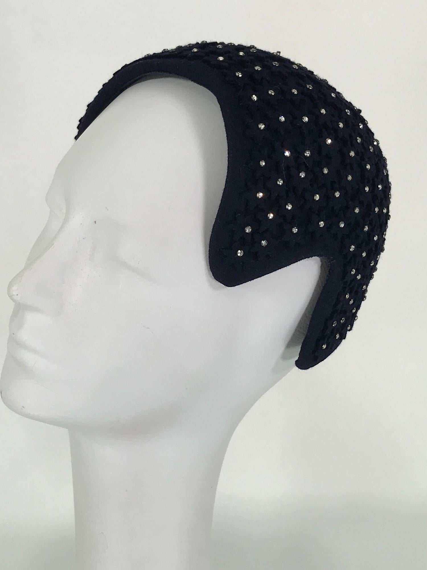 Alyce Reizian, 1940s black felt & rhinestone cocktail hat. Asymmetrical shaped hat designed to hug the head and glitter in the lights. In the day hats were designed to work as one with the hair dos of the day, an interesting concept. 
This beautiful