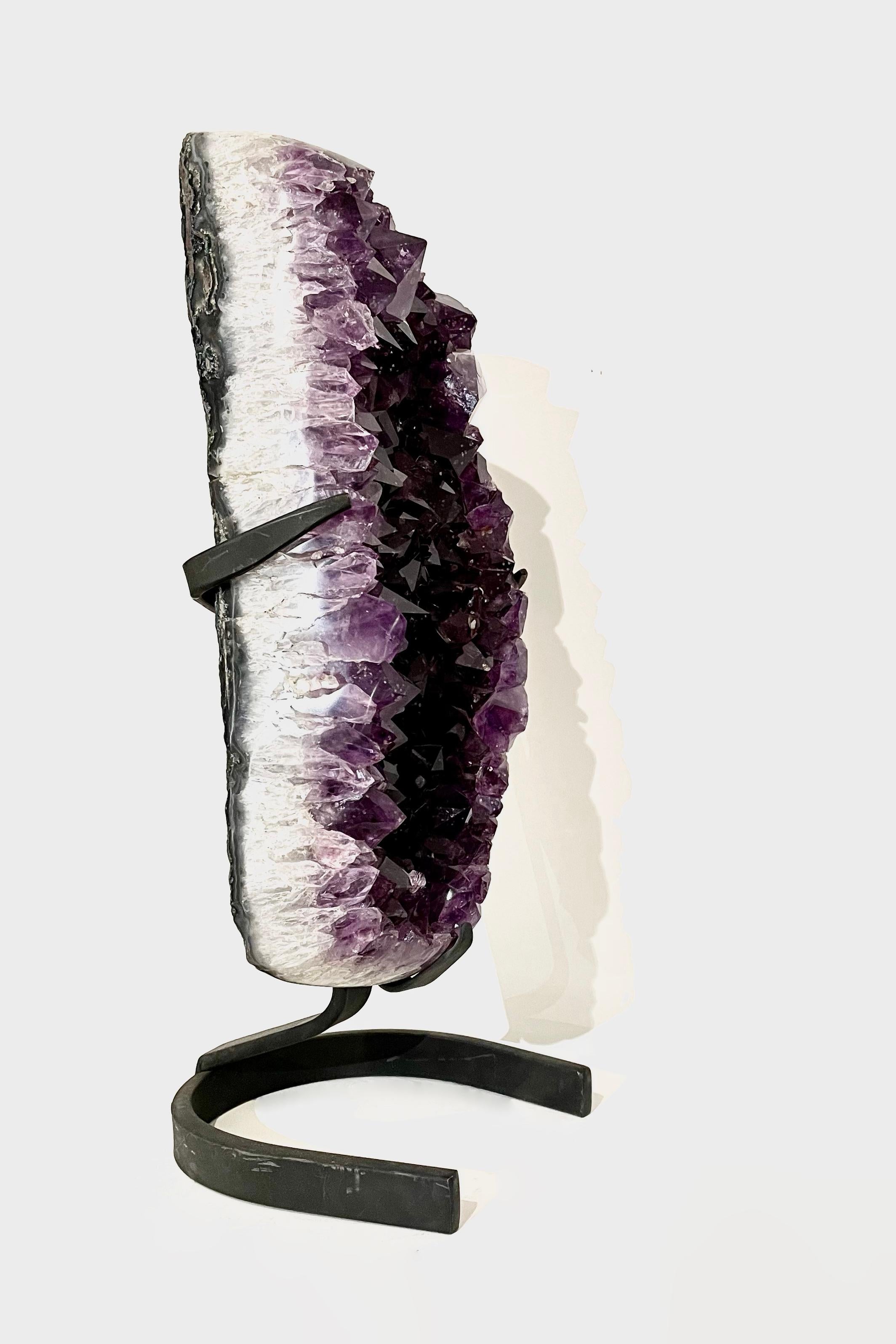 Amethyst crystal formation from Marabá, Brazil, Circa 50 million years old and in excellent condition. Complete with its own display stand. 

Dimensions: Approximately 50 x 16 x 10 cm

About E.O: From rare dinosaur skulls, crystals and Stone Age
