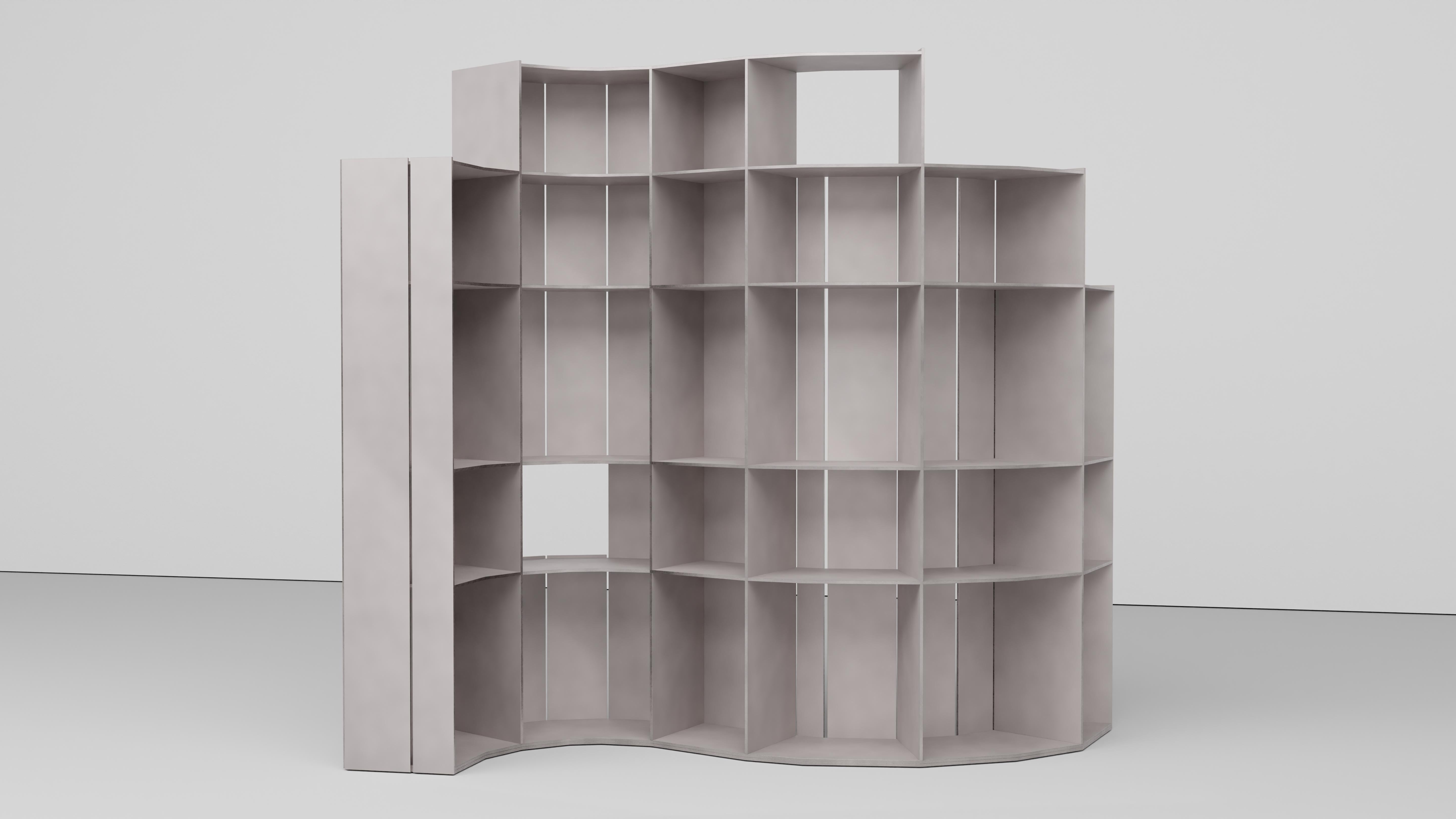 AM Floor Shelf in welded quarter inch thick aluminum plate with a polished and waxed finish.  Designed to display objects and books and double as a room divider. 
