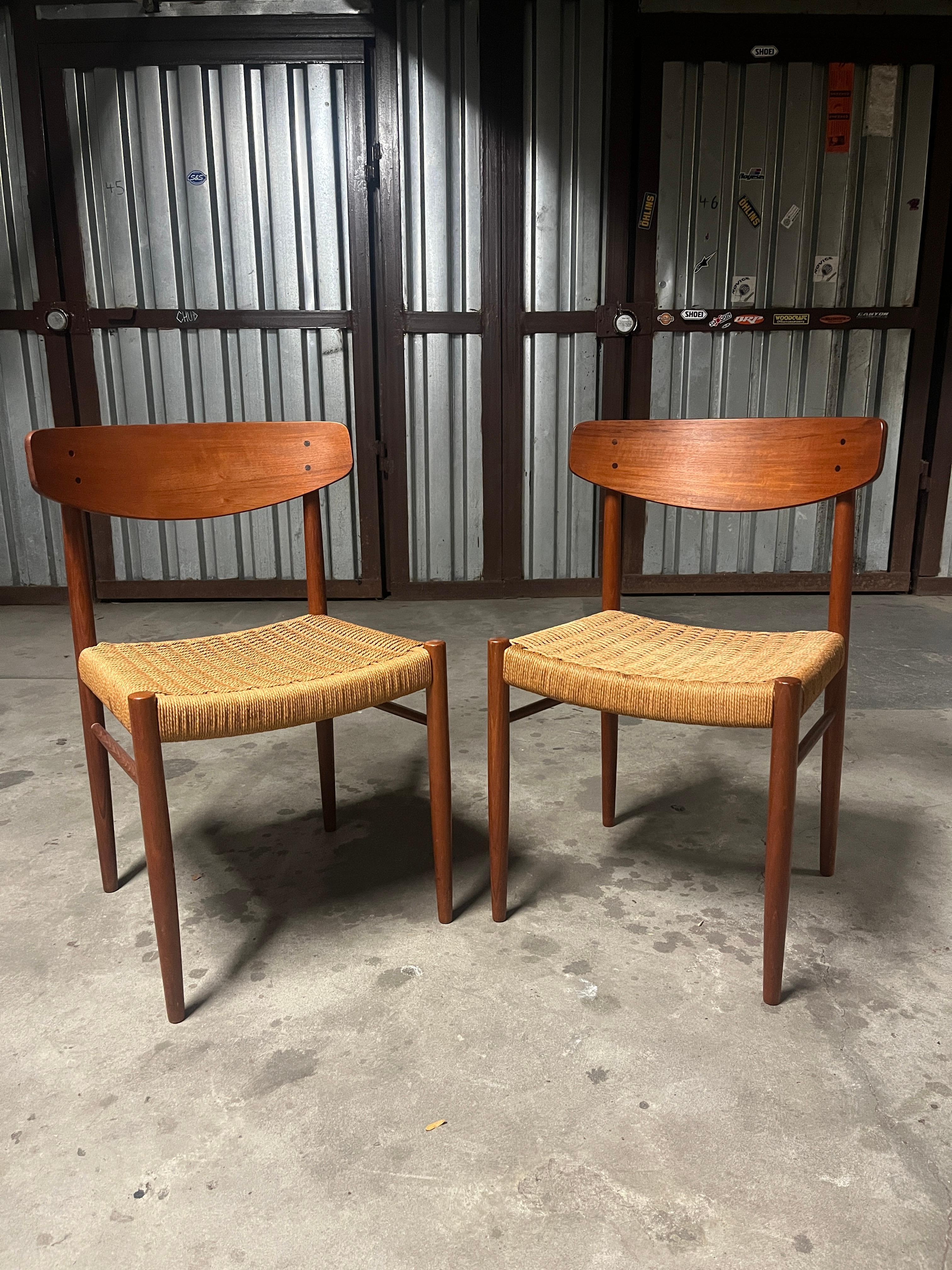 A.M. Møbler pair of teak and paper cord side chairs (model 501) 1960s. These beautiful Danish chairs were lightly used in a home where they shared the dining table with 4 other different chairs (pictured and also for sale). This is one beautiful
