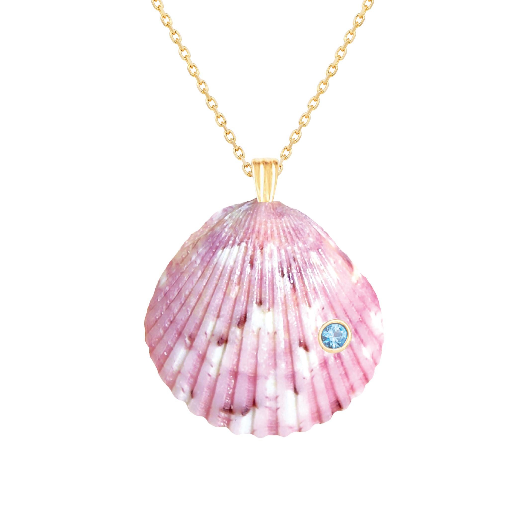 Natural shell pendant with solid 14k gold findings and natural blue topaz gemstone. Wear this pendant alone or layer it with other gold chains for a beautiful layered effect.  

Order includes one shell pendant, exactly as depicted in primary image.