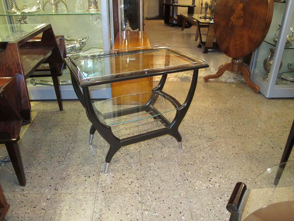 Amaizing Italian table.

Materials: wood , glass and chrome
If you want to live in the golden years, this is the coffe table that your project needs.
We have specialized in the sale of Art Deco and Art Nouveau and Vintage styles since 1982.
Pushing