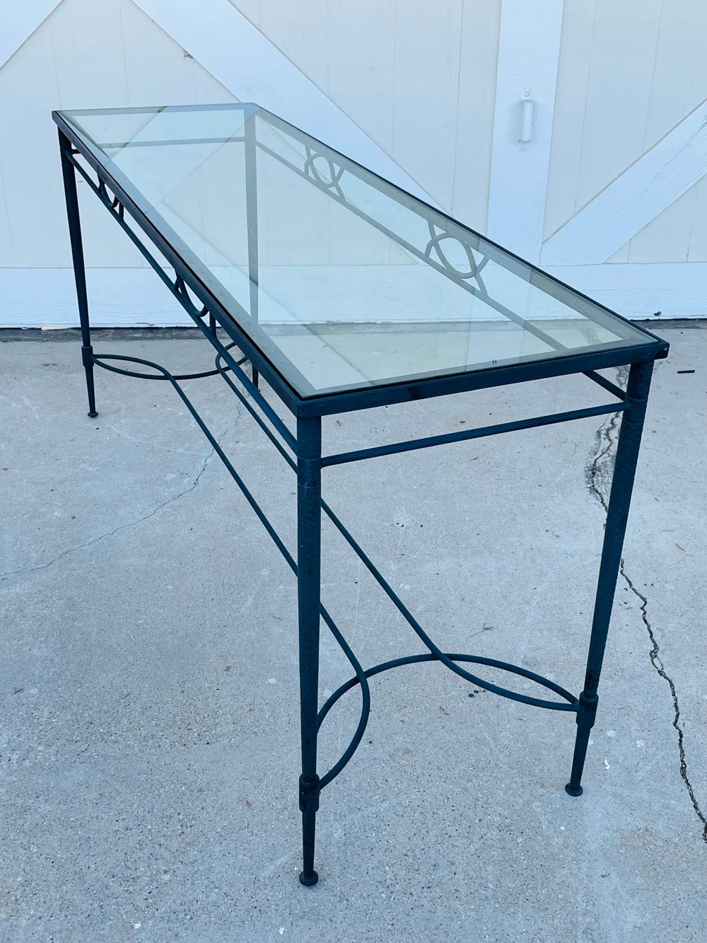 Beautiful cosole table made in solid iron with a slate finish and a glass top.

Beautiful arquitectural lines and perfect for indoor or outdoor settings.

Measurements:
60 inches wide x 18 inches deep x 28 inches high.
 