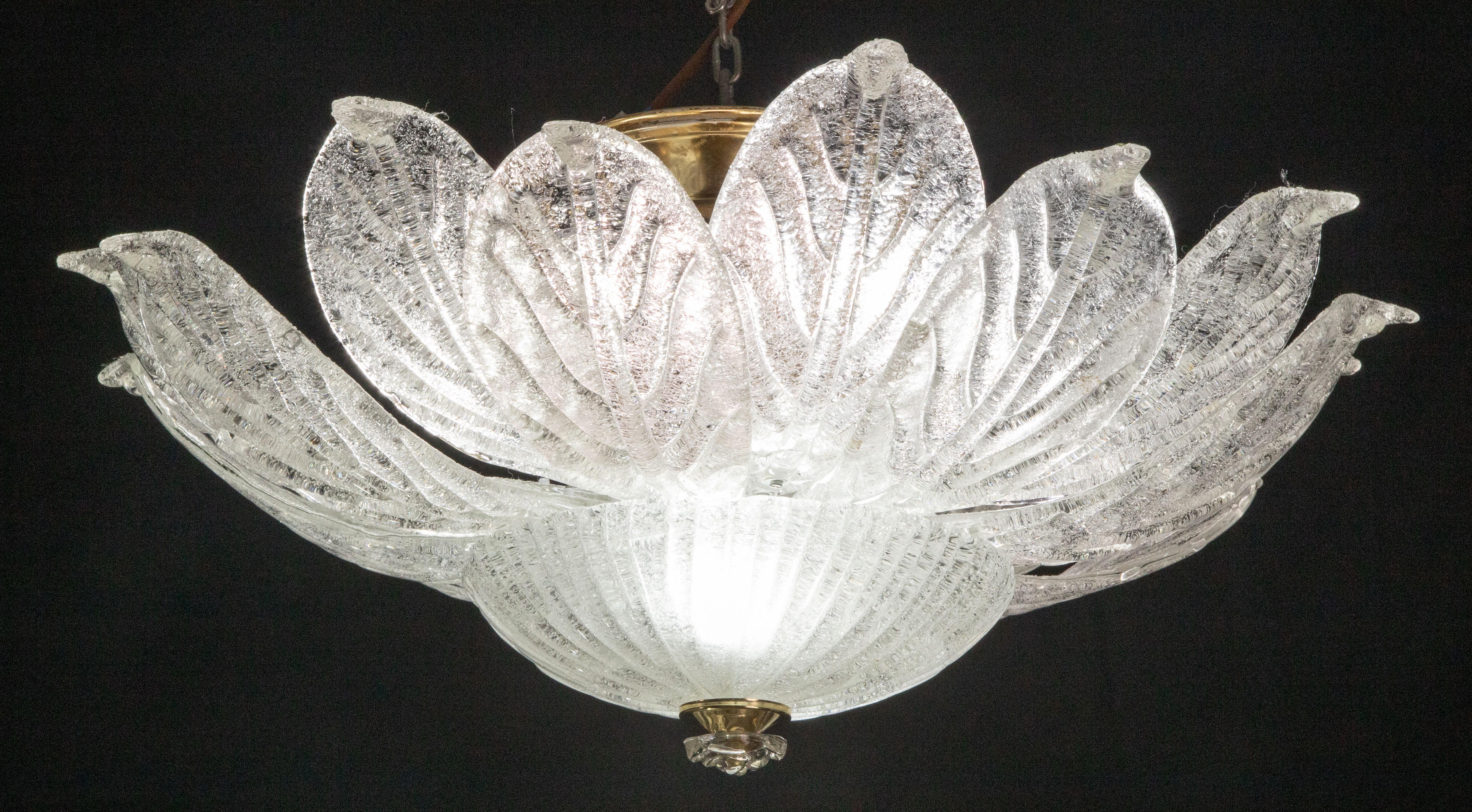 Splendid Murano glass ceiling lamp.

Period: circa 1970.

The light mounts 8 standard European e27 lamp holders plus 2 standard European e14 lamp holders

Perfect for decorating a large space.

Height measures 35 centimeters from the ceiling,