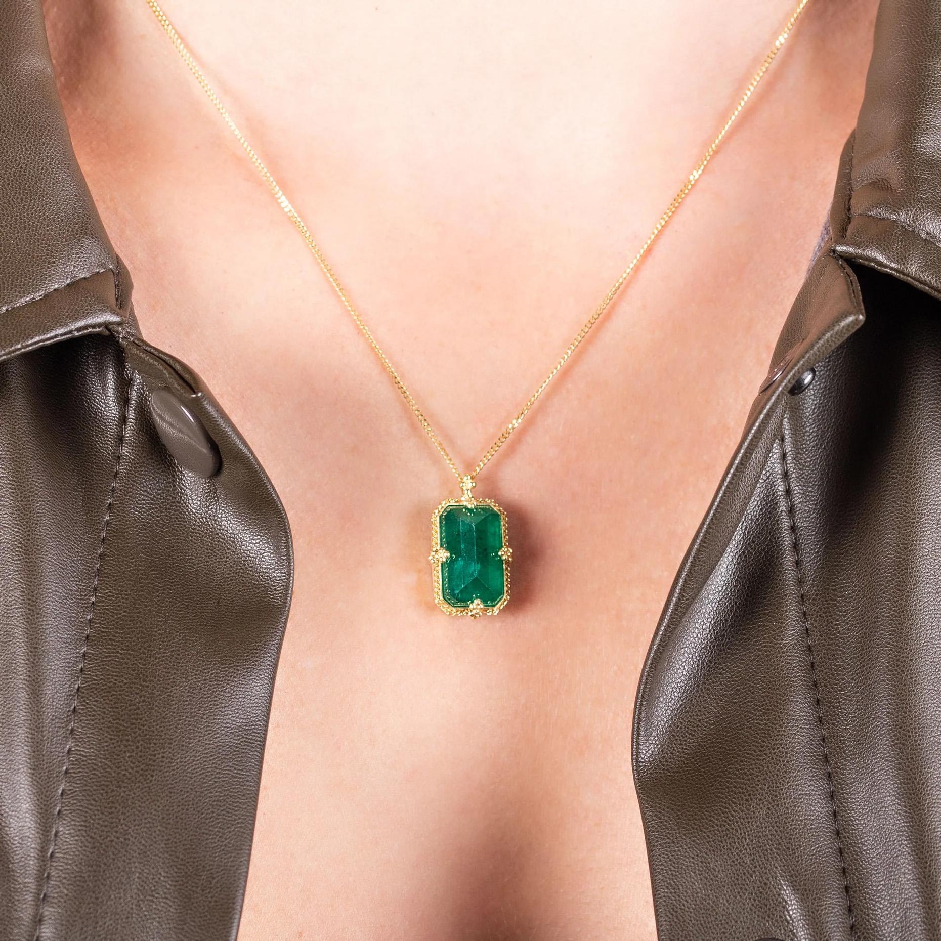 This pendant features a lush rectangular Emerald, the verdant gem’s rich natural hue glowing like new leaves in the hopeful light of springtime. This vibrant stone is set in our signature handmade gold bezel pendant with braided detail and suspended