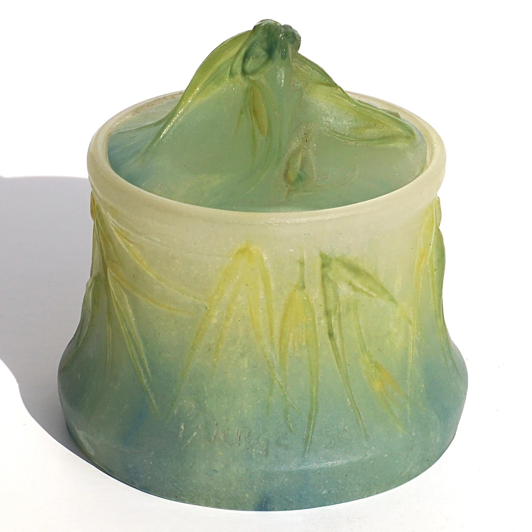 Amalric Walterand Henri Berge Pate De Verre Lidded Art Nouveau vase.

A gorgeous pâte-de-verre floral box or jar with lid by Almeric Walter. The 3.7 inch tall pâte-de-verre box has a background of frosted yellowish white, blue and green glass,