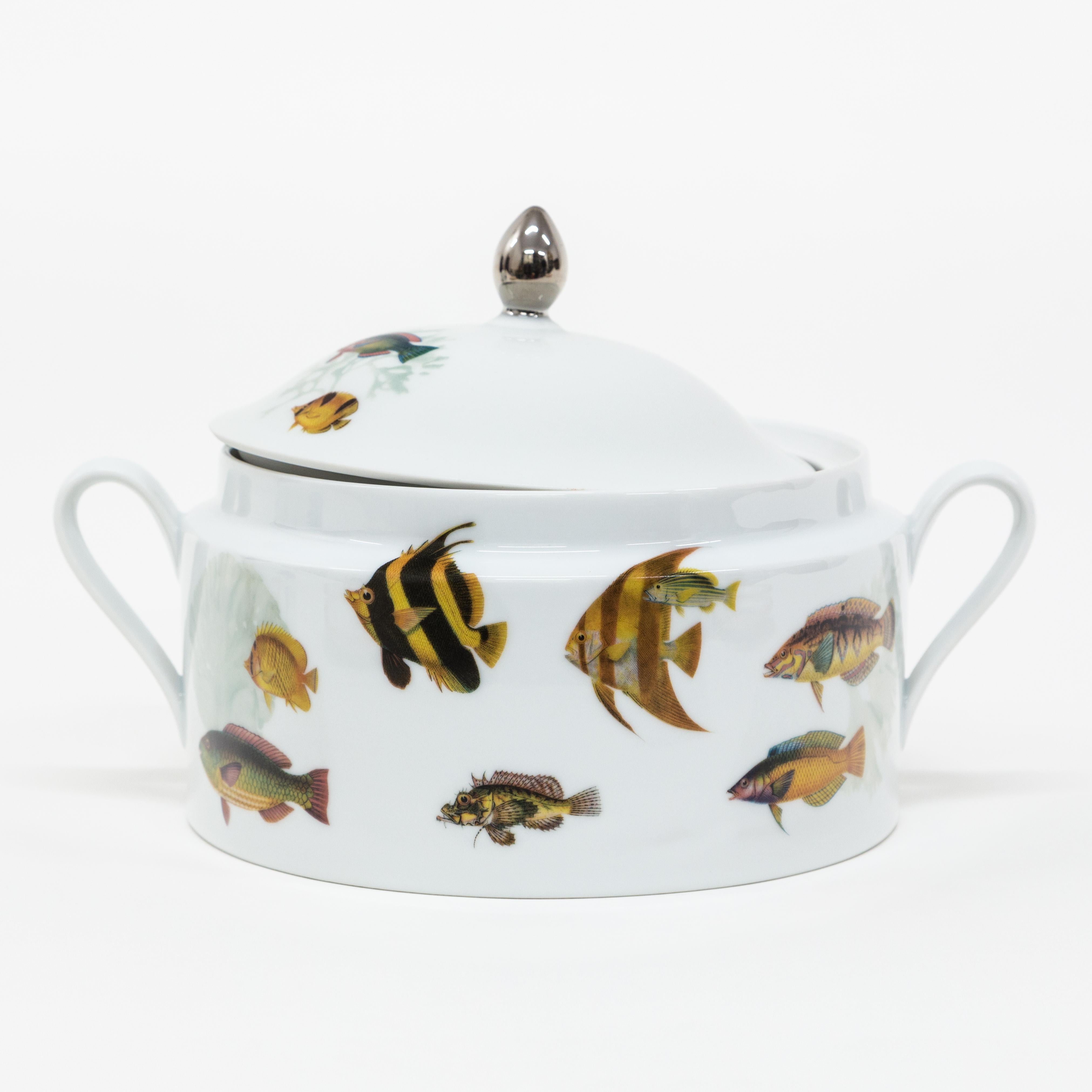 This soup tureen is a Grand Tour piece by Vito Nesta that is part of the Amami porcelain collection. The coral reef of the Amami Islands, an archipelago off the coast of Japan, inspired the design of this product where colourful fish swim on the