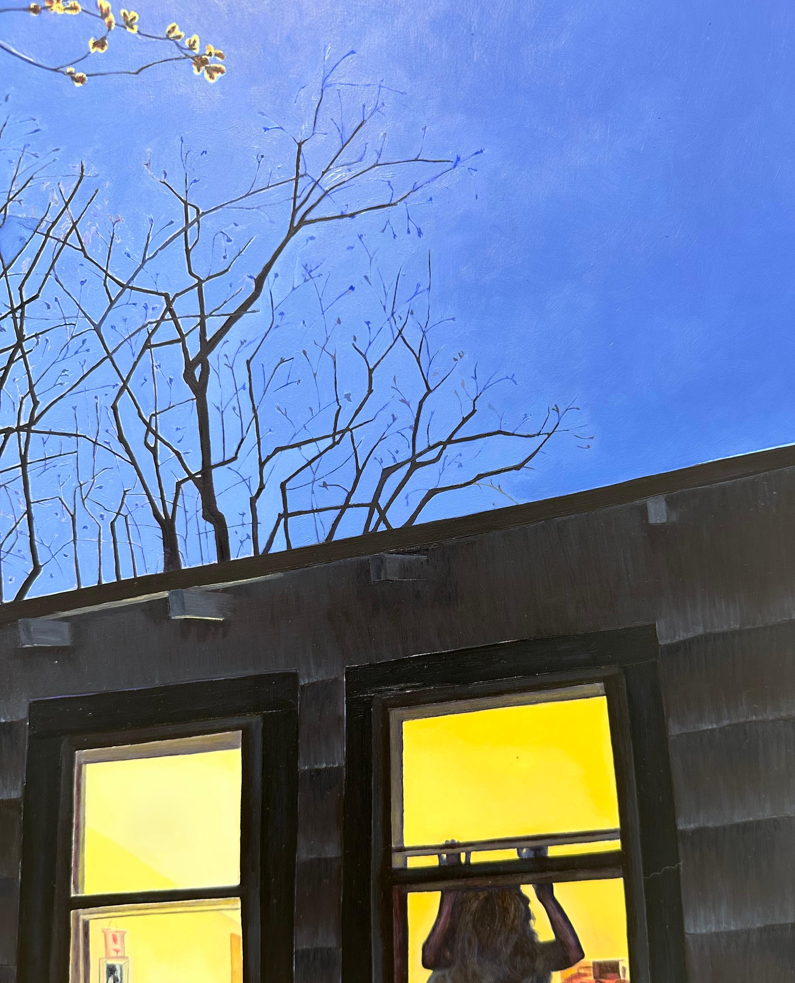 Spring Chill, Female Figure in Window, House at Night, Blue, Black Tree Branches - Contemporary Painting by Amanda Acker