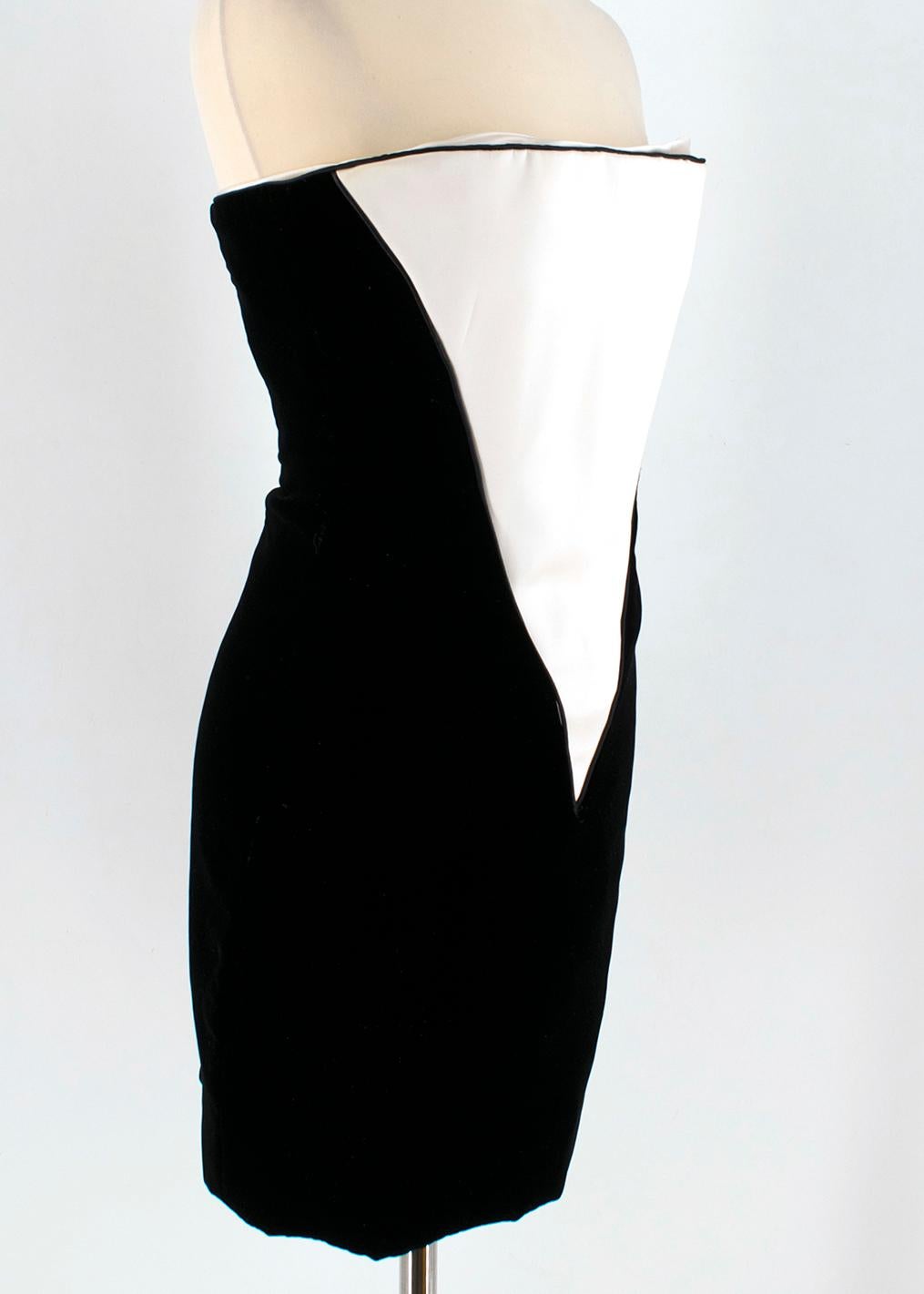 Amanda Wakeley Black Velvet Dress with White Silk Insert

- velour black dress
- white silk inserts
- buster silhouette
- internal bustier for extra hardness and support
- silk lining 
- hidden zip closure to the back

Please note, these items are