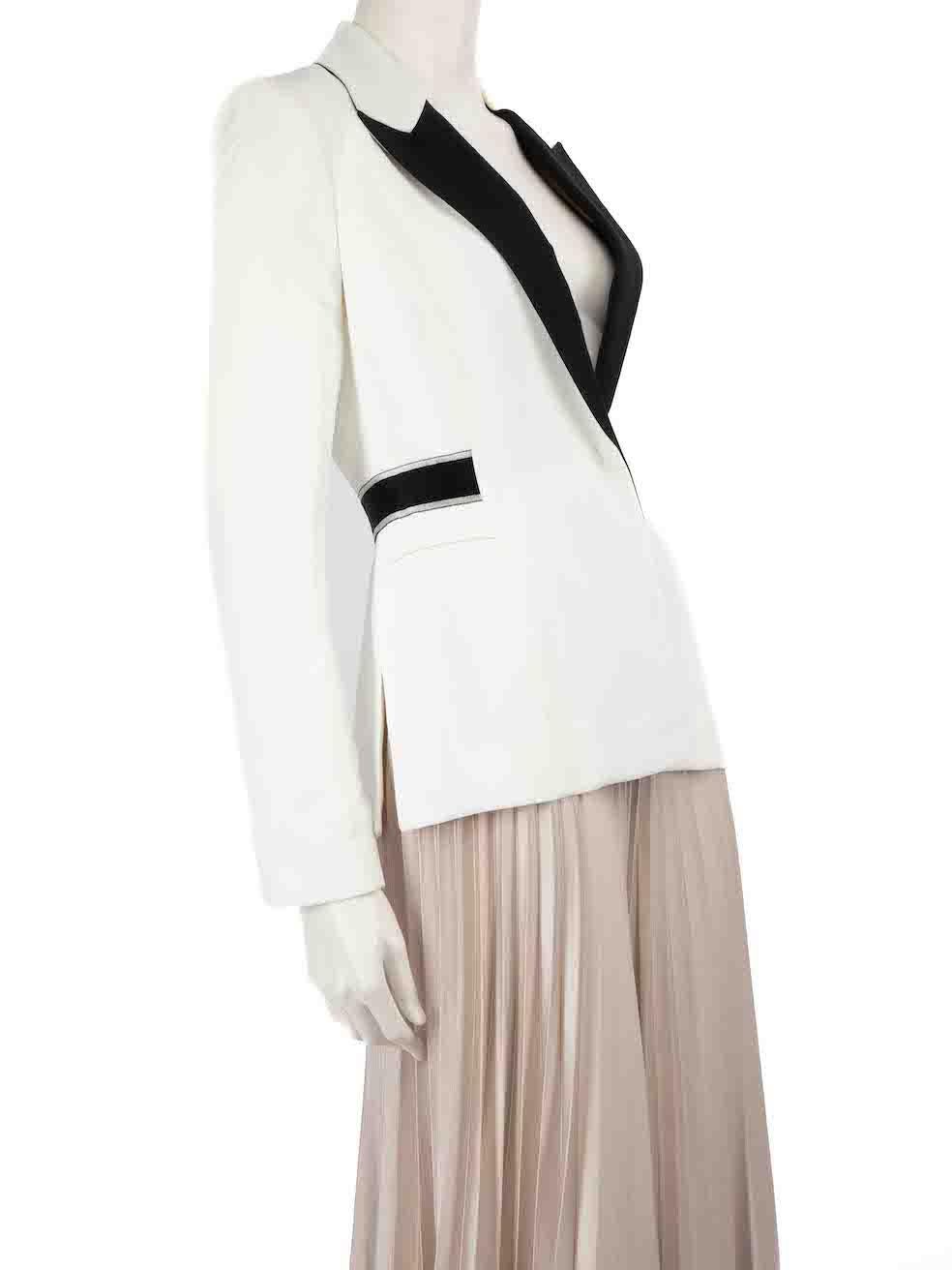 CONDITION is Good. General wear to blazer is evident. Moderate signs of wear to exterior fabric, with discolouration to lapel edge around neck, shoulder seams, cuff edges and hem on this used sample Amanda Wakeley designer resale item.
 
 
 
