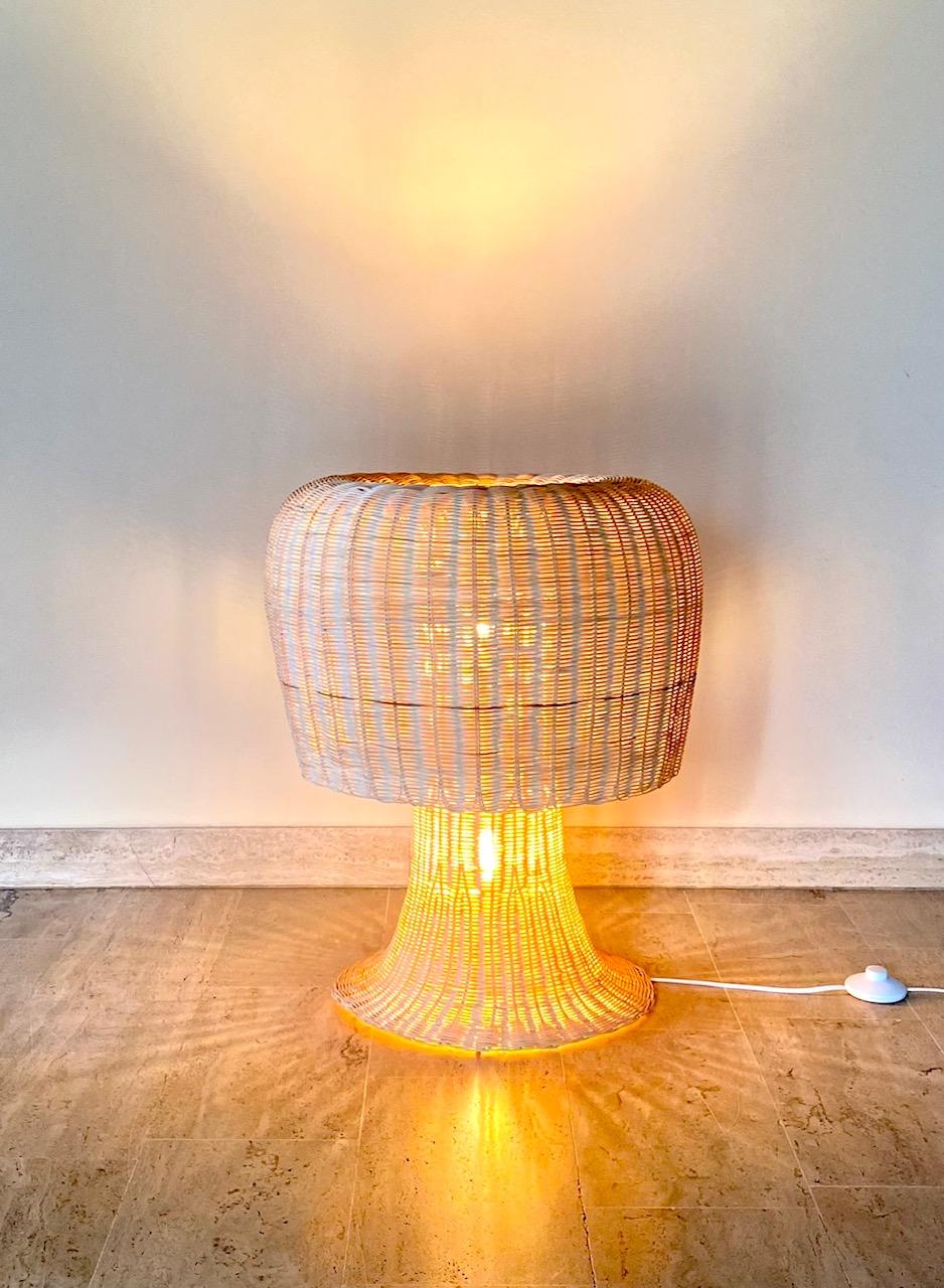 Amanita Fc23 floor lamp by Campana Brothers for Alessi, 2000s
Triple ignition lamp made of woven rattan with two bulbs which include three light combinations. 

The light filtered by the rattan creates Dumb games on the walls. 
You can light the