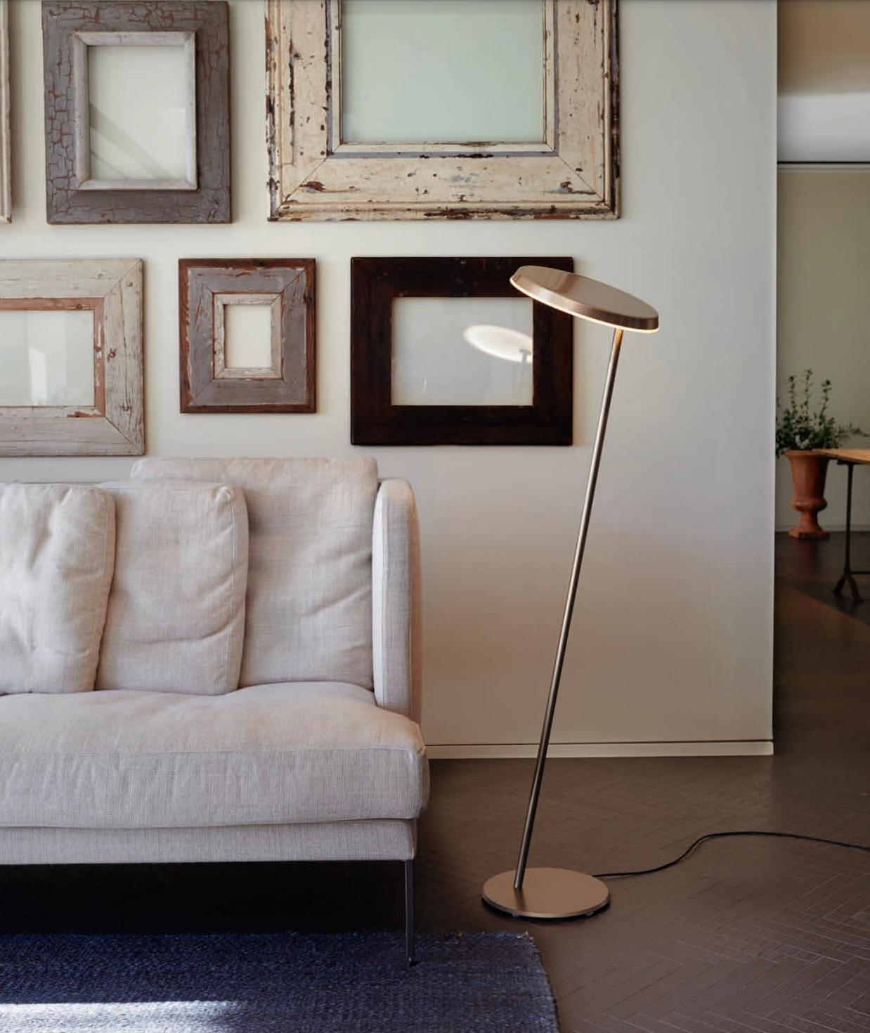 'Amanita' floor lamp by Mariana Pellegrino Soto for Oluce. 

Simple yet refined, this geometric floor lamp is crafted by Oluce in Italy using only the highest quality materials and scrupulous attention to detail. Executed in anodic bronze painted
