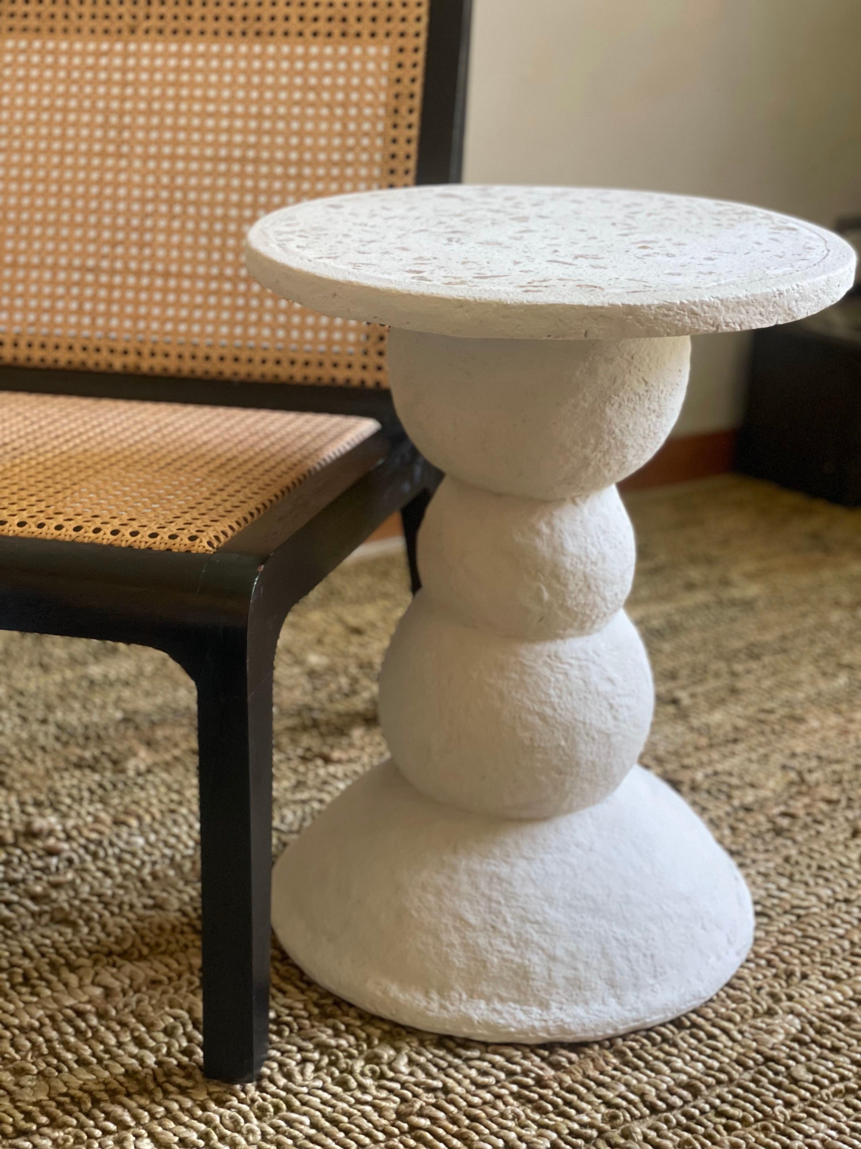 Amanita table by Ana Tron.
Handmade
Dimensions: D 40 x H 65 cm
Materials: Recycled paper with paste and matt water-based varnish. Concrete top with pieces of recycled wood.

Side table with base made of paper recycling and concrete top with recycled
