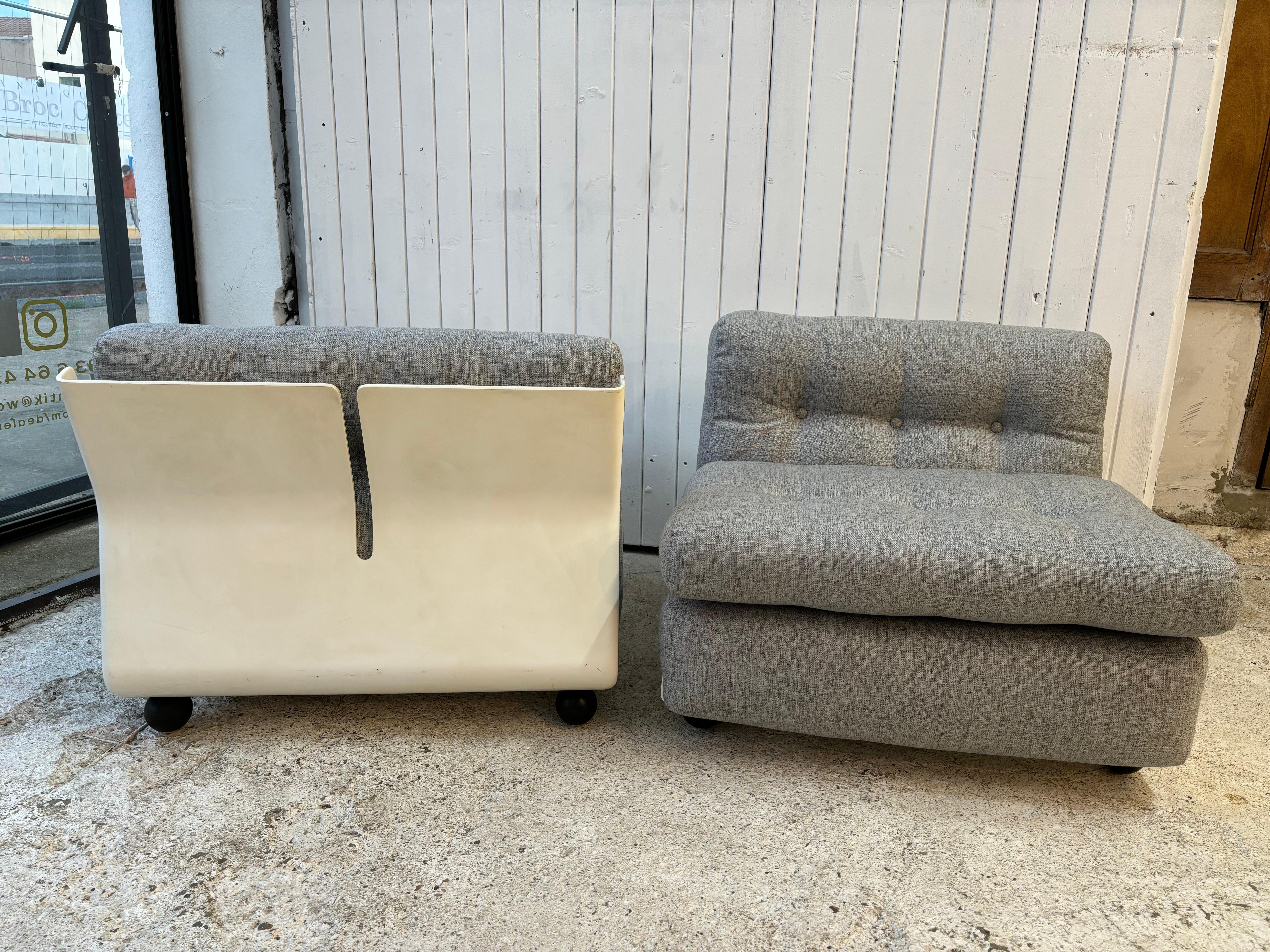 Wonderful pair of Amanta Chairs , reupholstered in grey clear so 70’s style

The armchair is cubic in shape. The frame is made from a single piece of reinforced polyester with a slot in the middle of the backrest to reinforce the resistance of the
