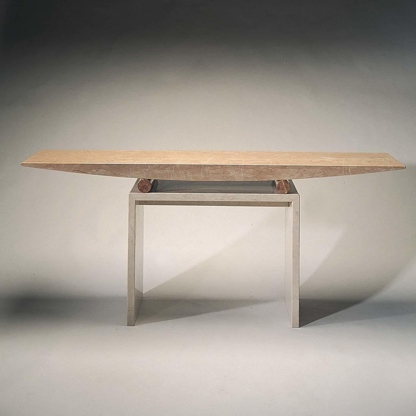 Designed by Danilo Silvestrin in 1987, this captivating table expresses a sense of well-being derived from nature. The clean-cut and strikingly simple design is distinguished by sharp angles and soft rounded silhouettes. The base is made of solid