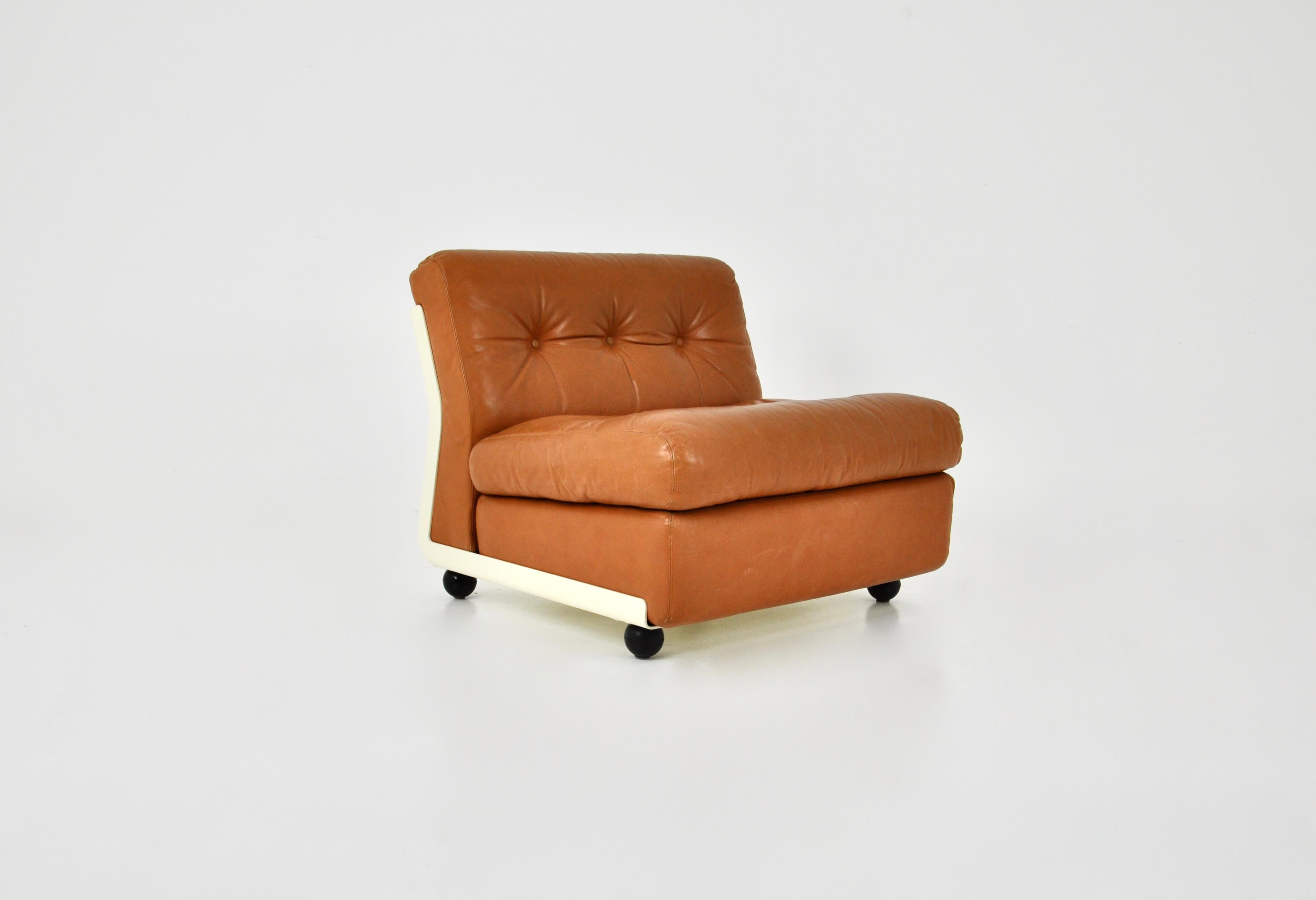 Armchair with cognac-coloured leather and white fibreglass shell. Designed by Mario Bellini for B&B Italia. Seat height: 43 cm. Stamped B&B Italia. Wear due to time and age.
