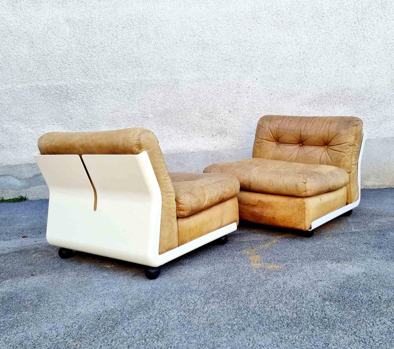 A pair of 'Amanta' leather and fiberglass lounge chairs, originally designed in Italy by Mario Bellini for C&B Italia in 1966. The design was extremely popular and in great demand, with a waitlist for eager purchasers. The 'Amanta' was produced as a
